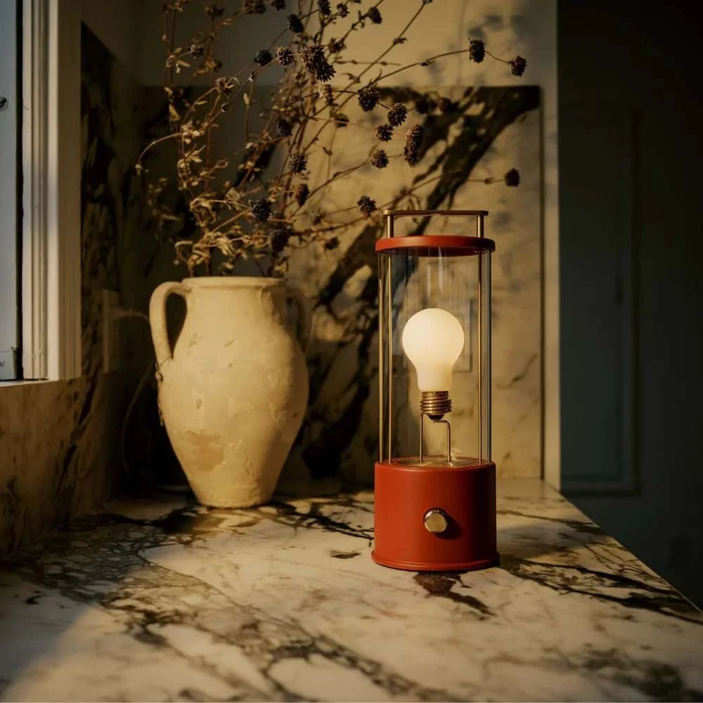 red portable bathroom light with gold handle