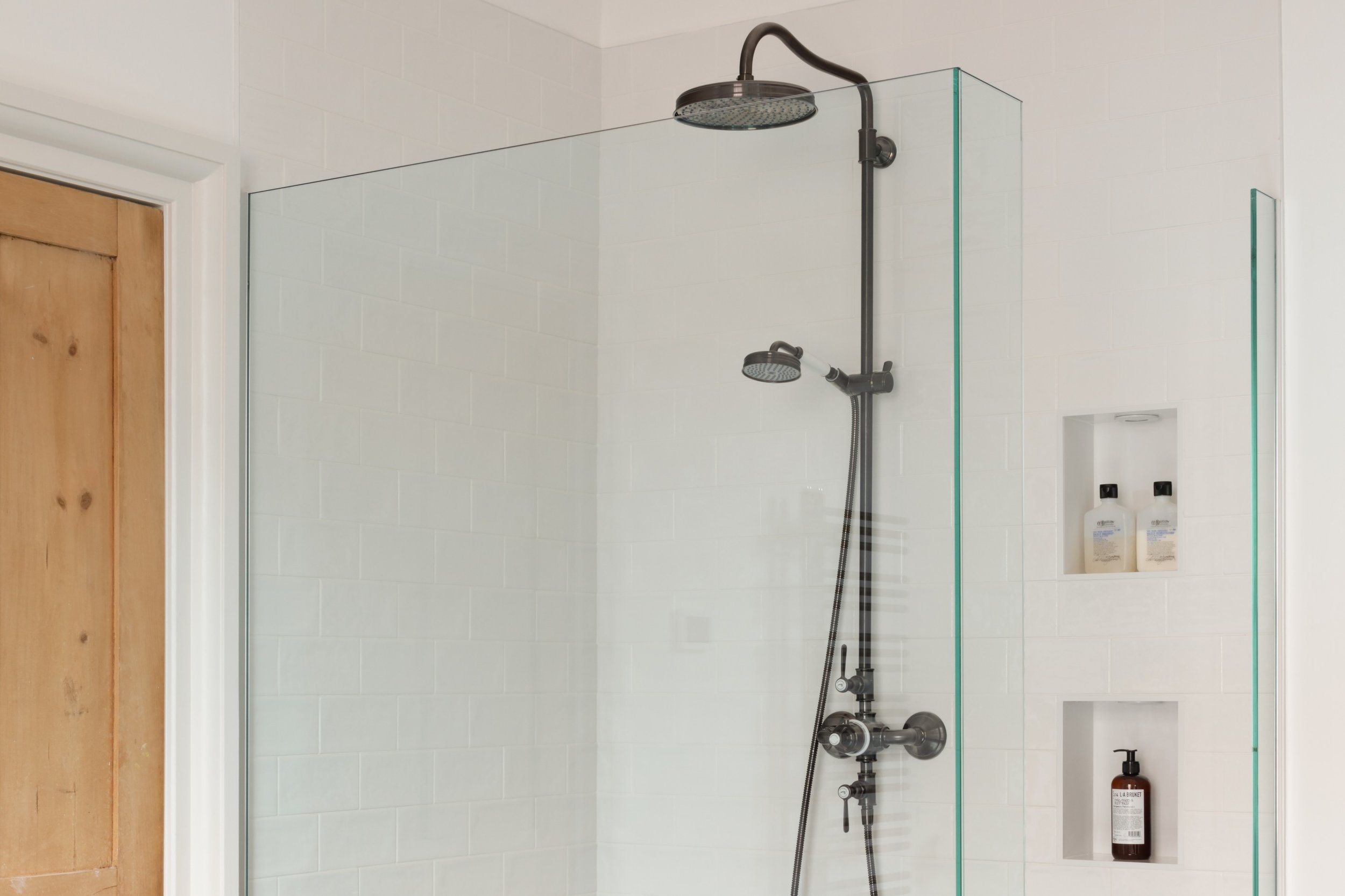 traditional shower with storage niches