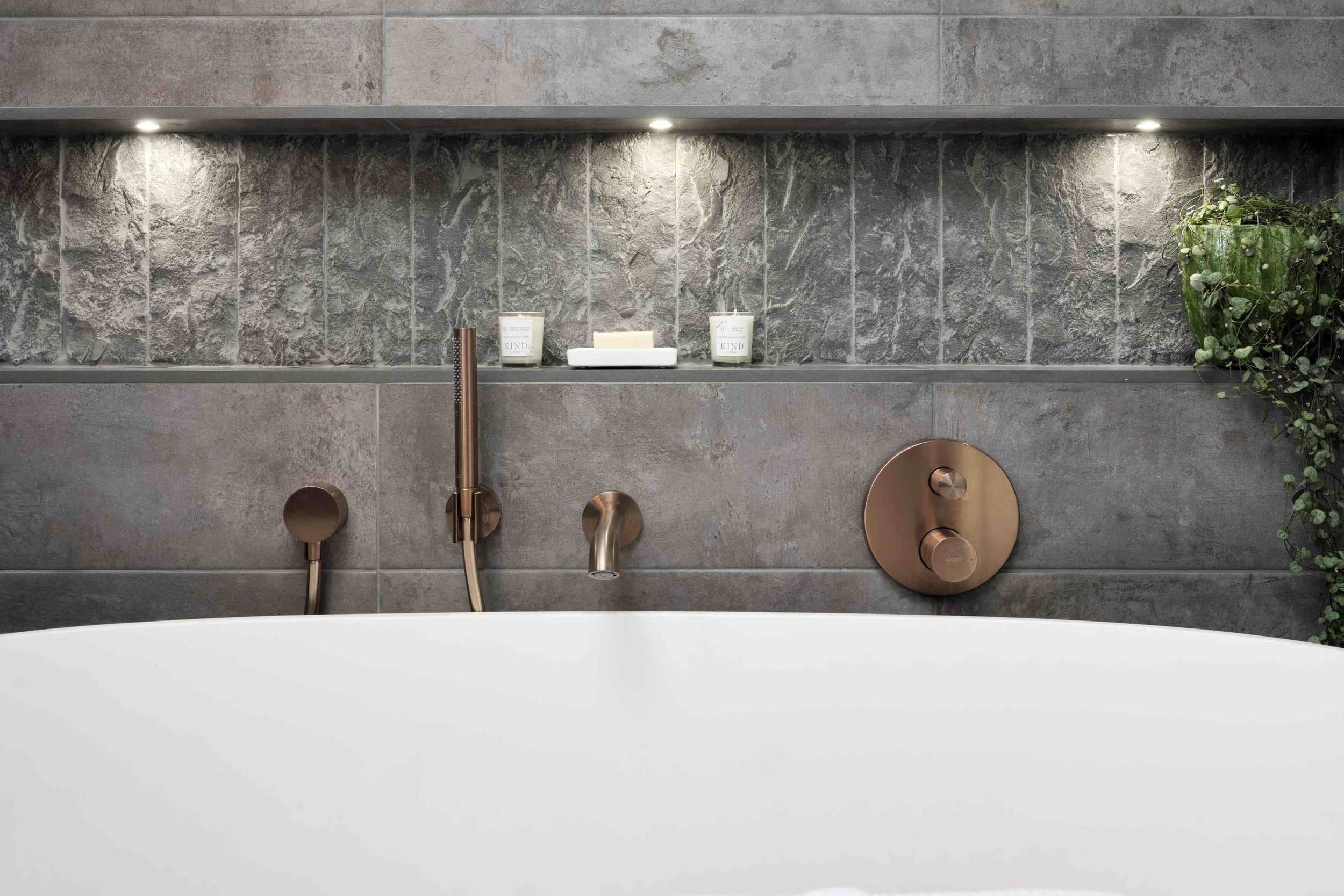 storage-niche-behind-bath-with-bronze-brassware.jpg