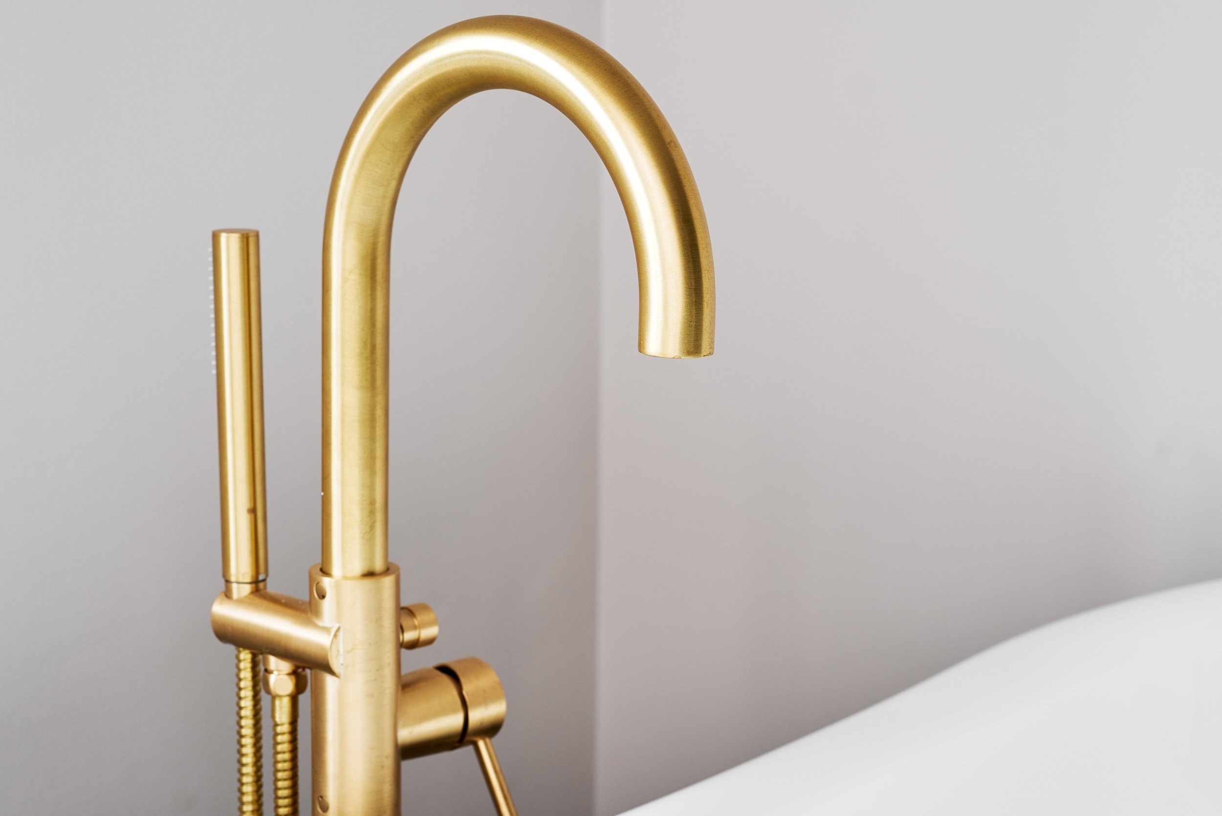 close-up-of-gold-curved-tap.jpg