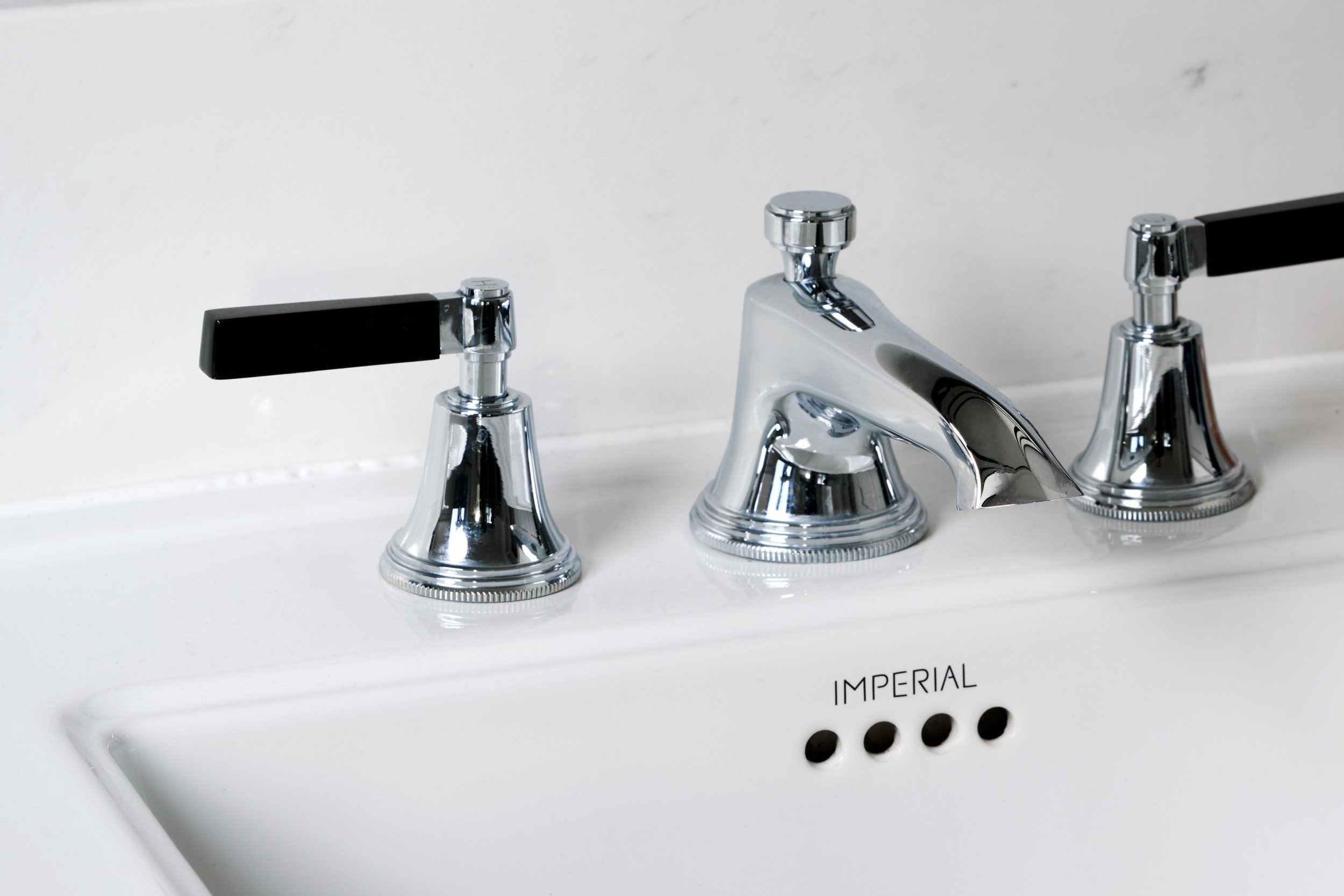 chrome-bathroom-taps-with-black-handles.jpg