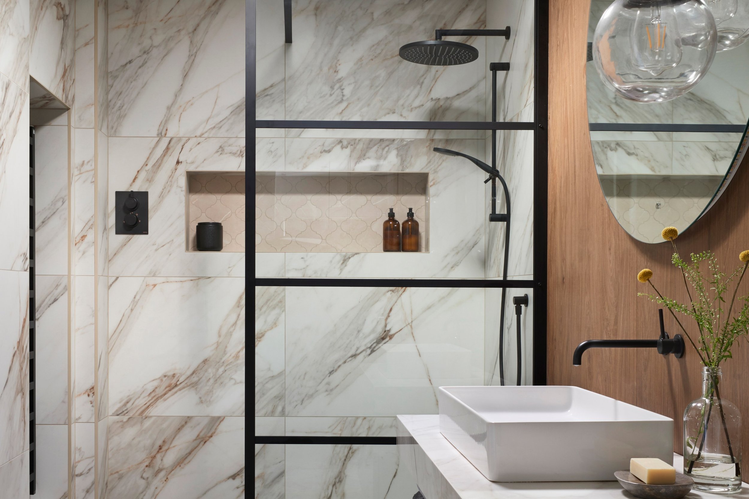 bathroom-with-crittall-style-shower-glass-and-marble-effect-tiles.jpg