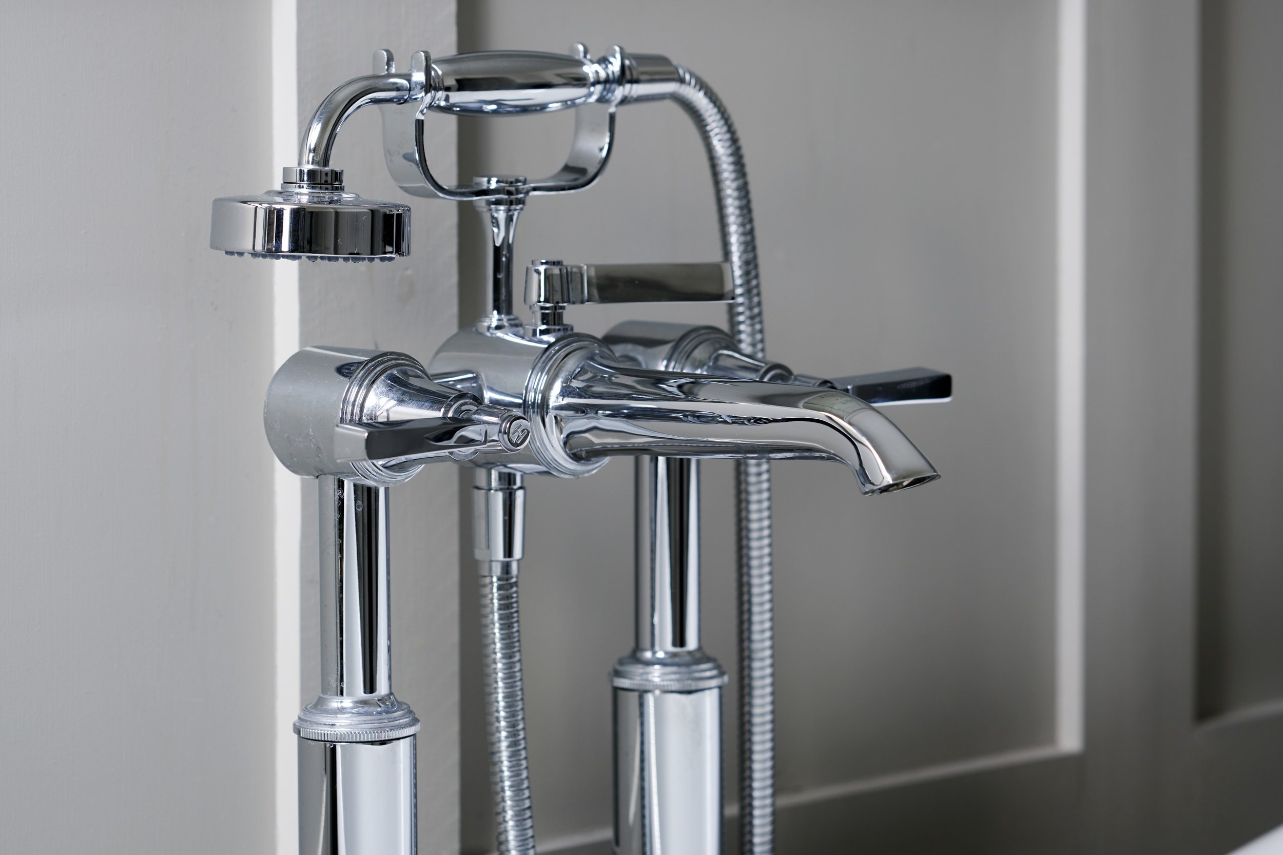 traditional-chrome-taps-against-panelled-bathroom.jpg