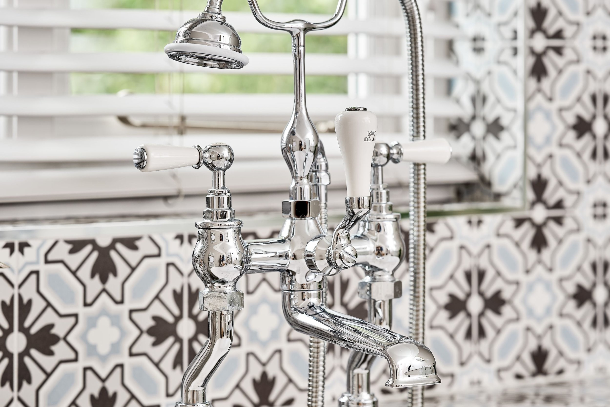 close-up-of-traditional-chrome-bath-mixer-and-shower.jpg