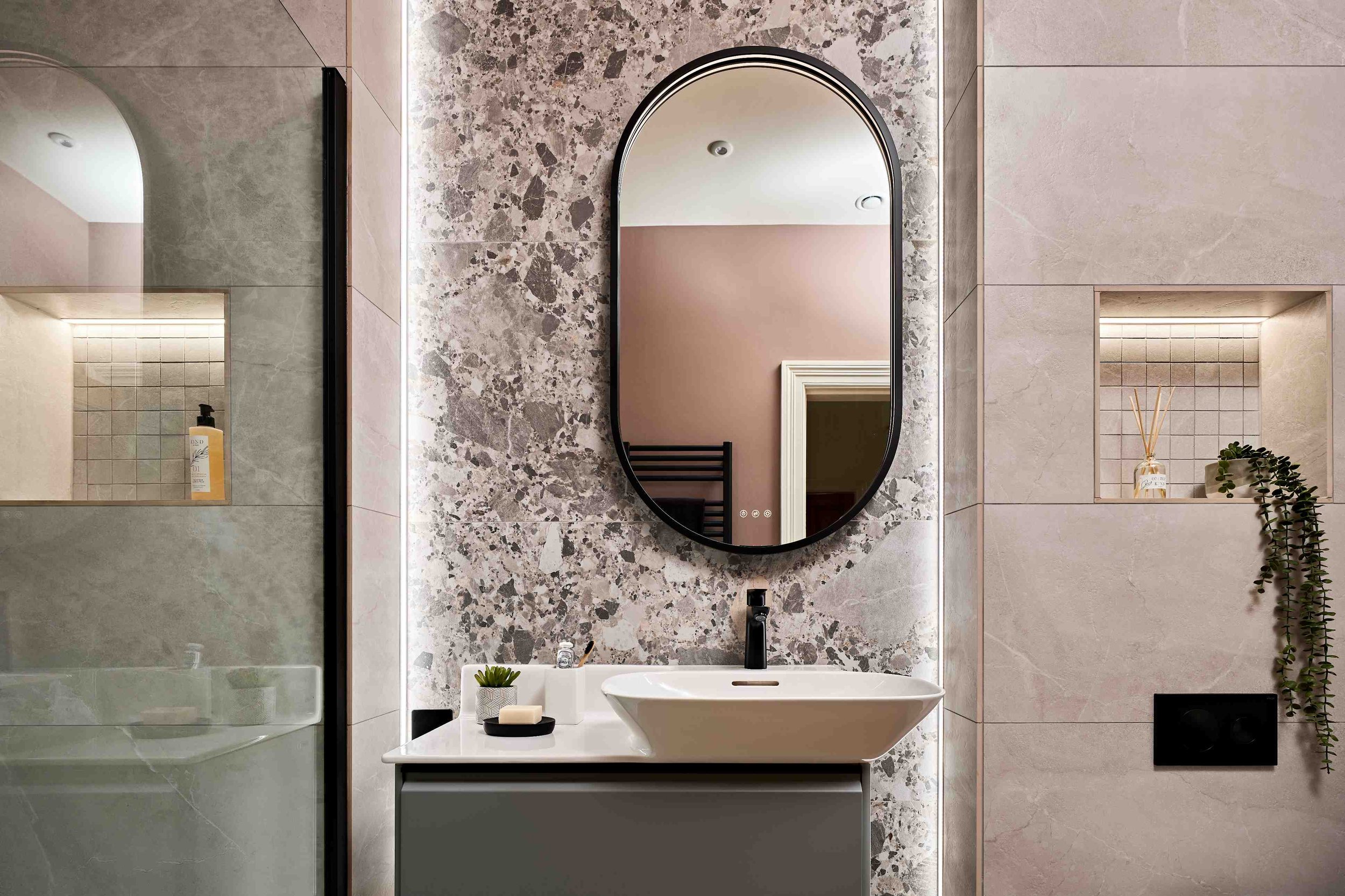 ripples-bathroom-with-oval-mirror-and-atmospheric-lighting.jpg
