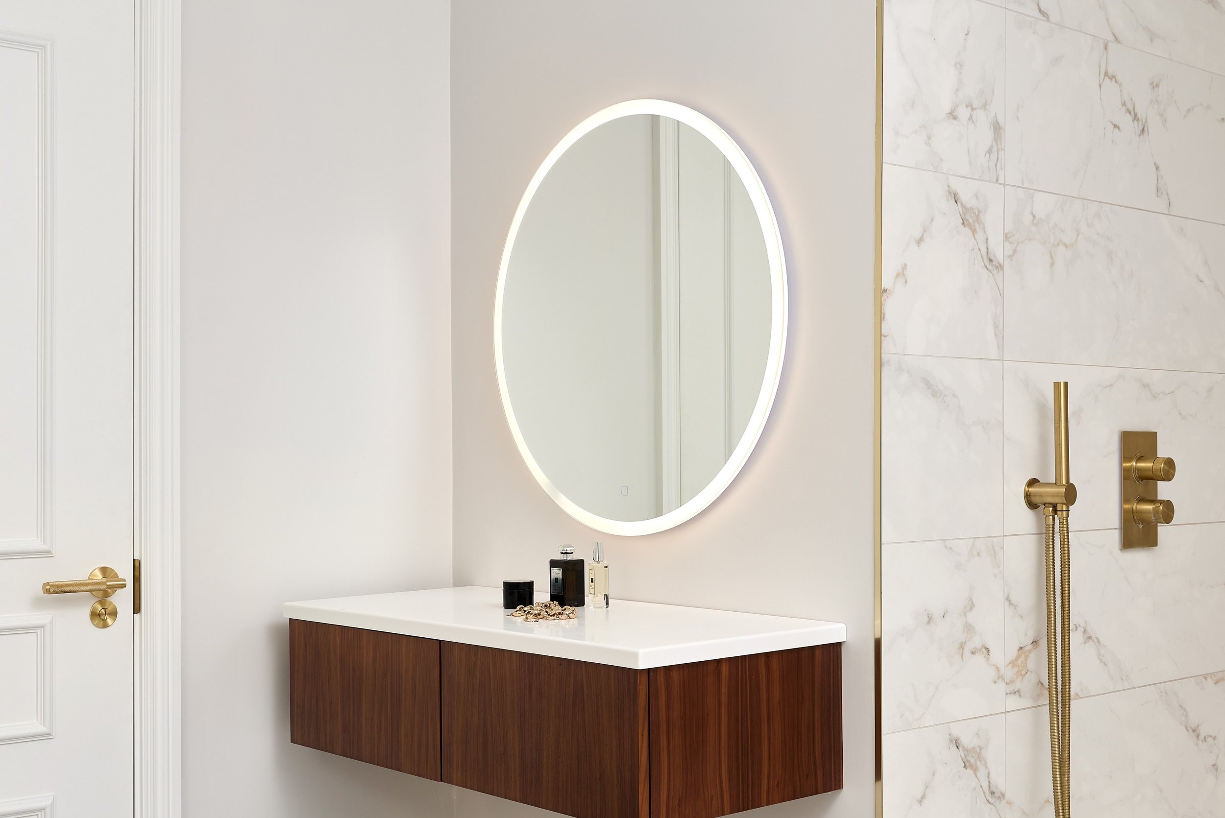 ripples-bathroom-with-dressing-room-area-and-round-mirror.jpg