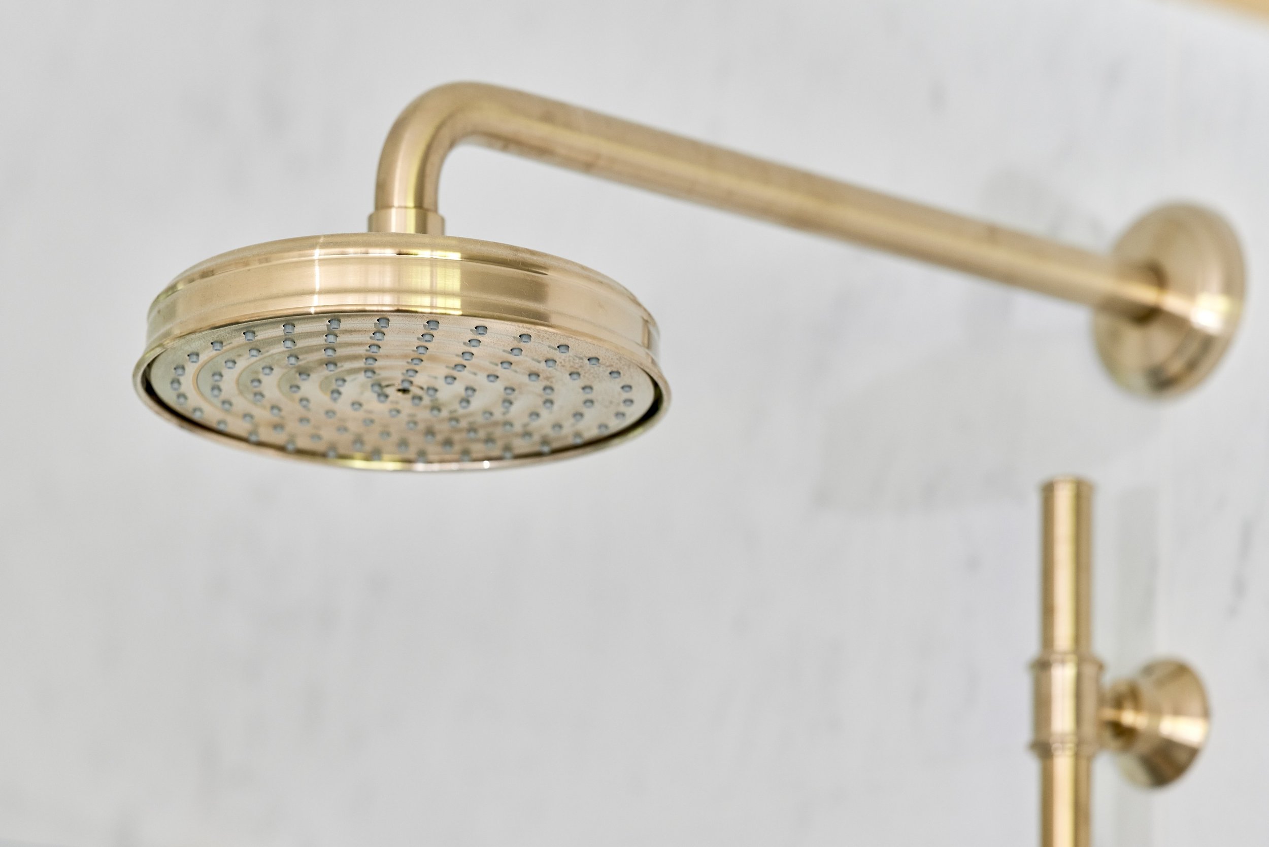 close-up-of-brushed-brass-showerhead.jpg
