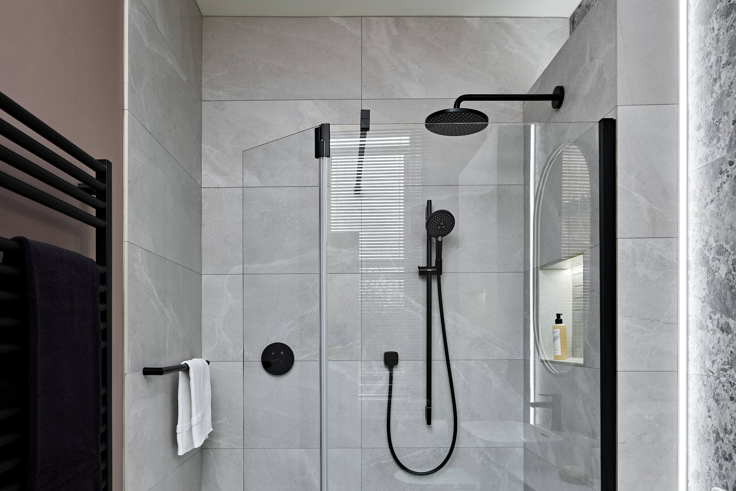 close-up-of-shower-room-with-bold-brassware.jpg
