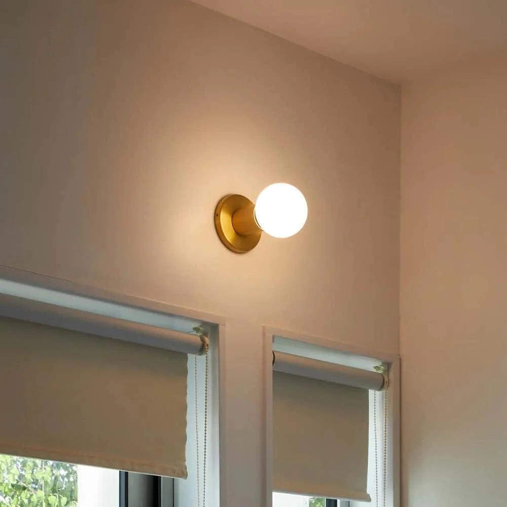 small round light with brass fixture
