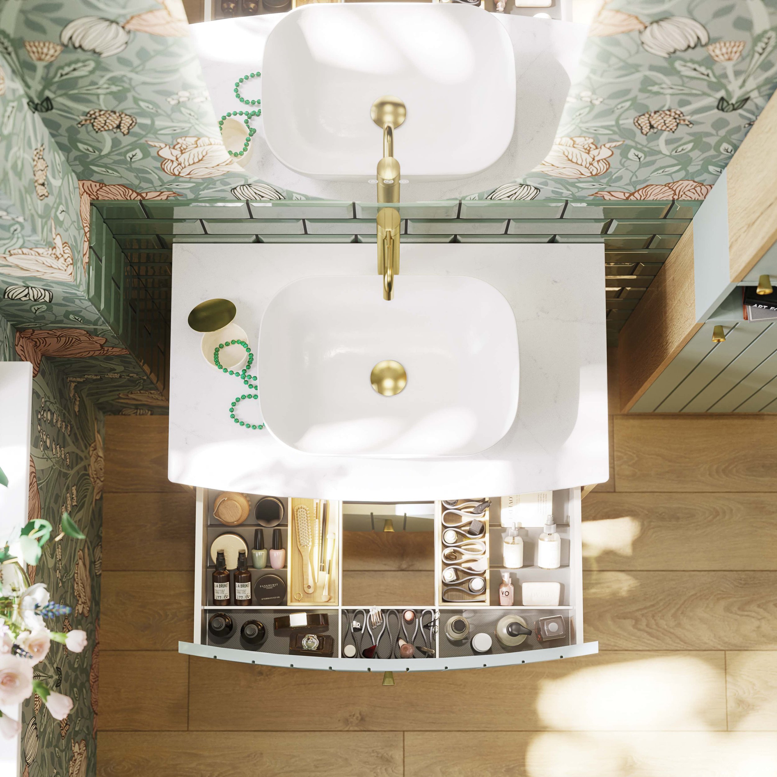 Green grooved bathroom vanity unit agains floral wallpaper looking from above into open draw