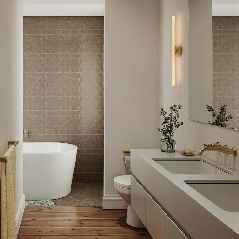 Bathroom overlooking to a room with a bath, double basins and a T-Bar shaped light
