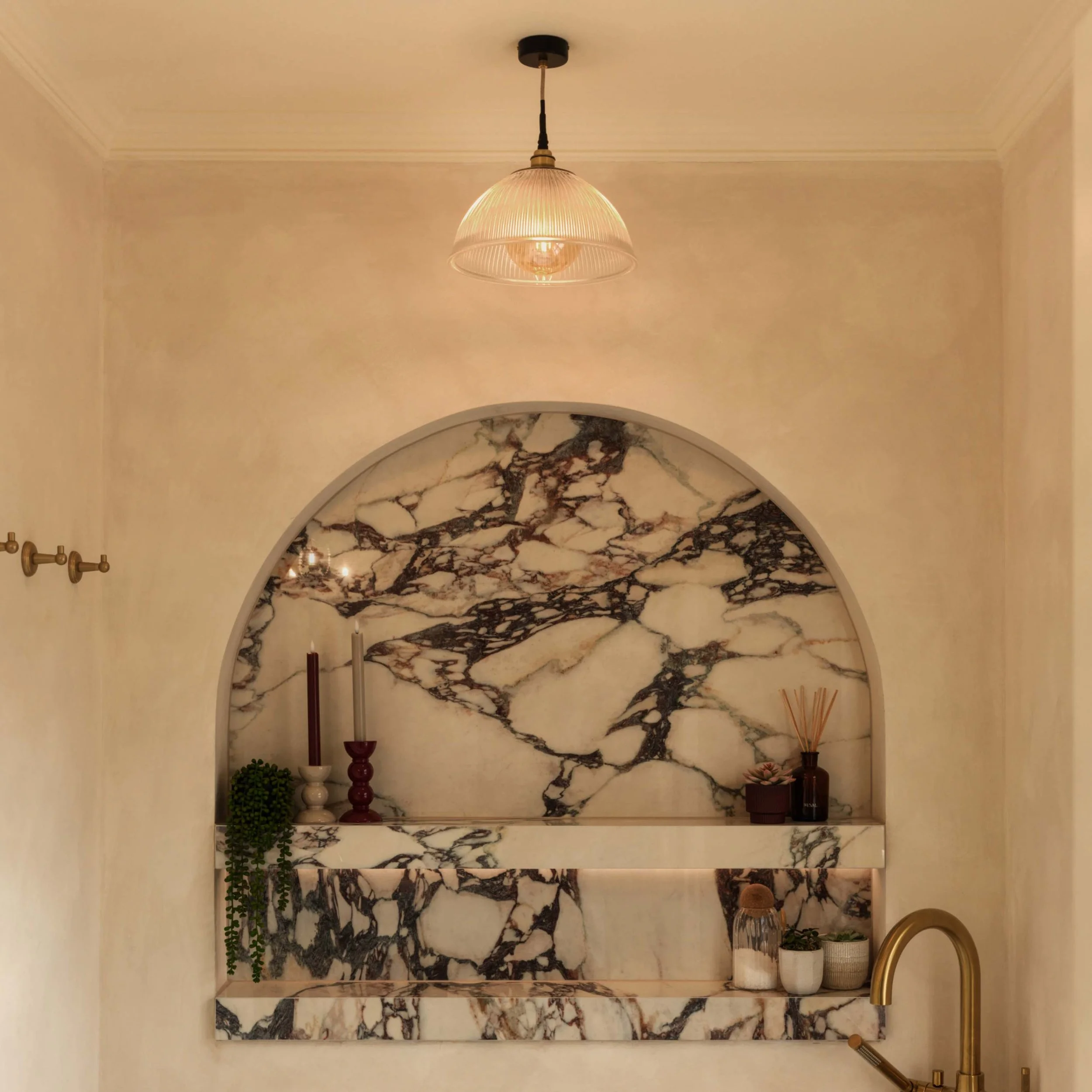 fluted glass dome light on against arched marble wall