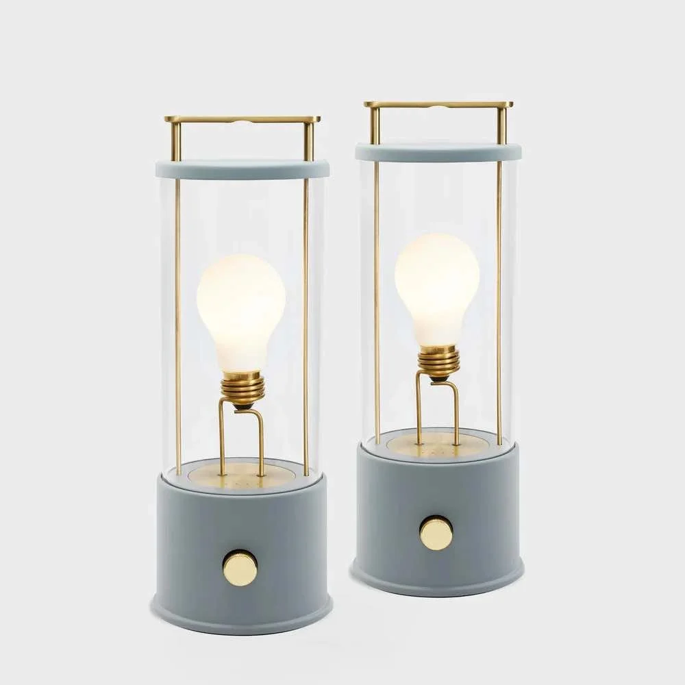 pale blue portable bathroom light with gold handle