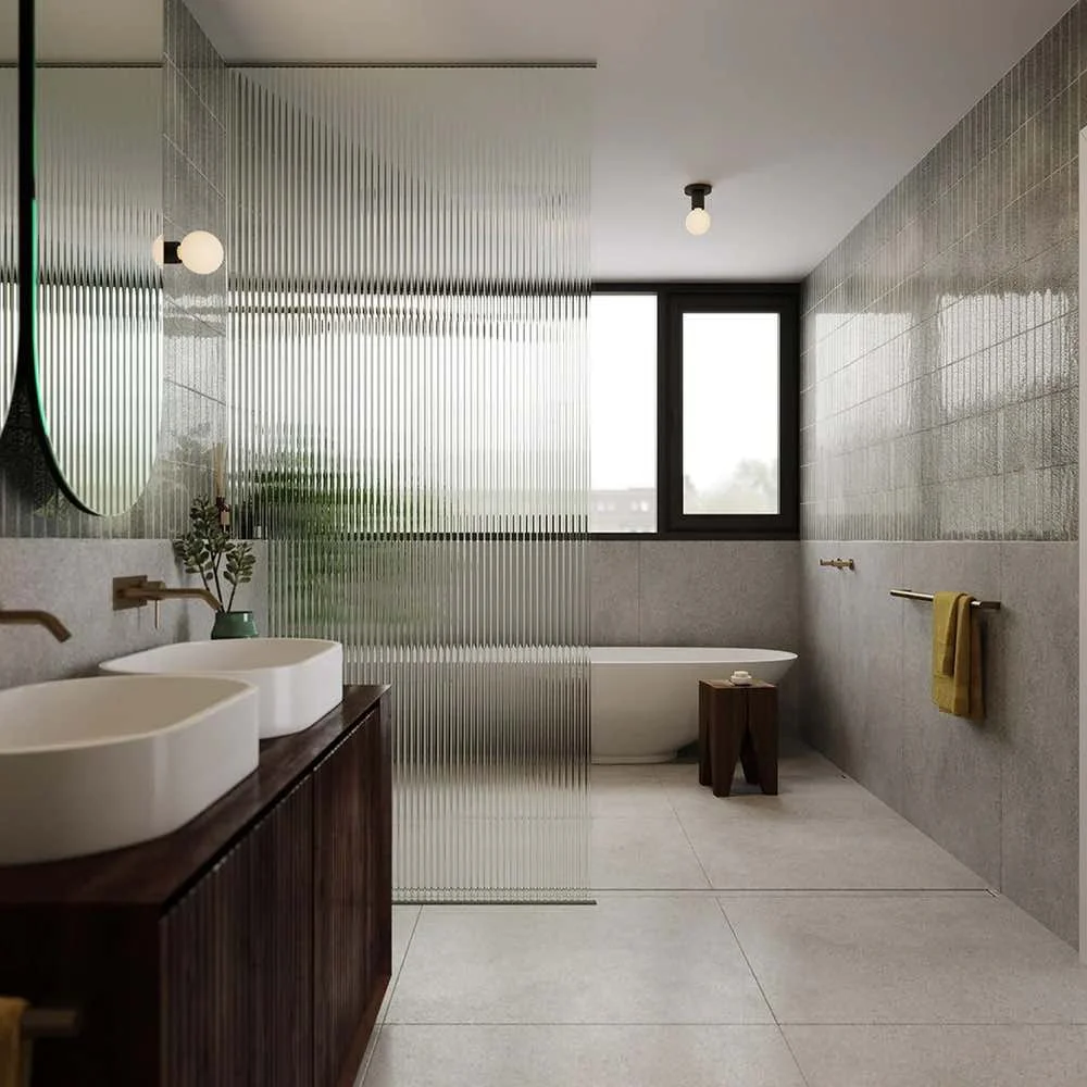 bathroom with double basins and walk in shower. Small round lights one on wall and one on ceiling.