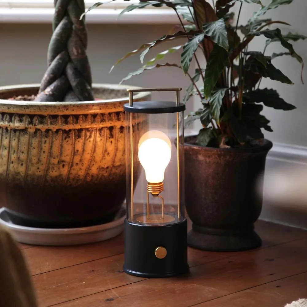 black portable bathroom light with gold handle