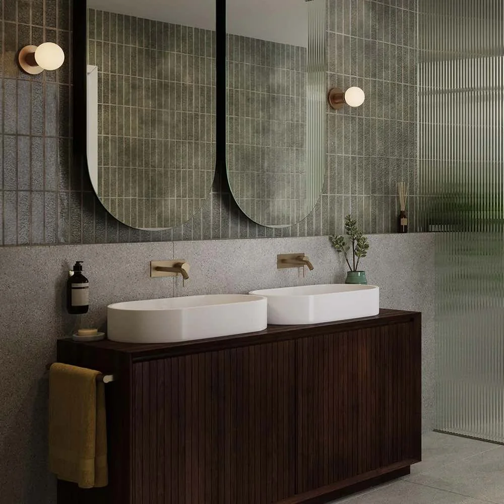double basin with two oval mirrors with small round lights either side
