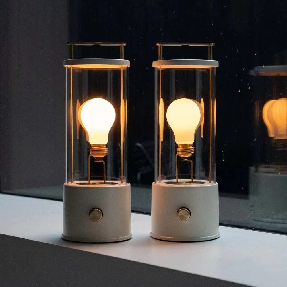 white portable bathroom light with gold handle