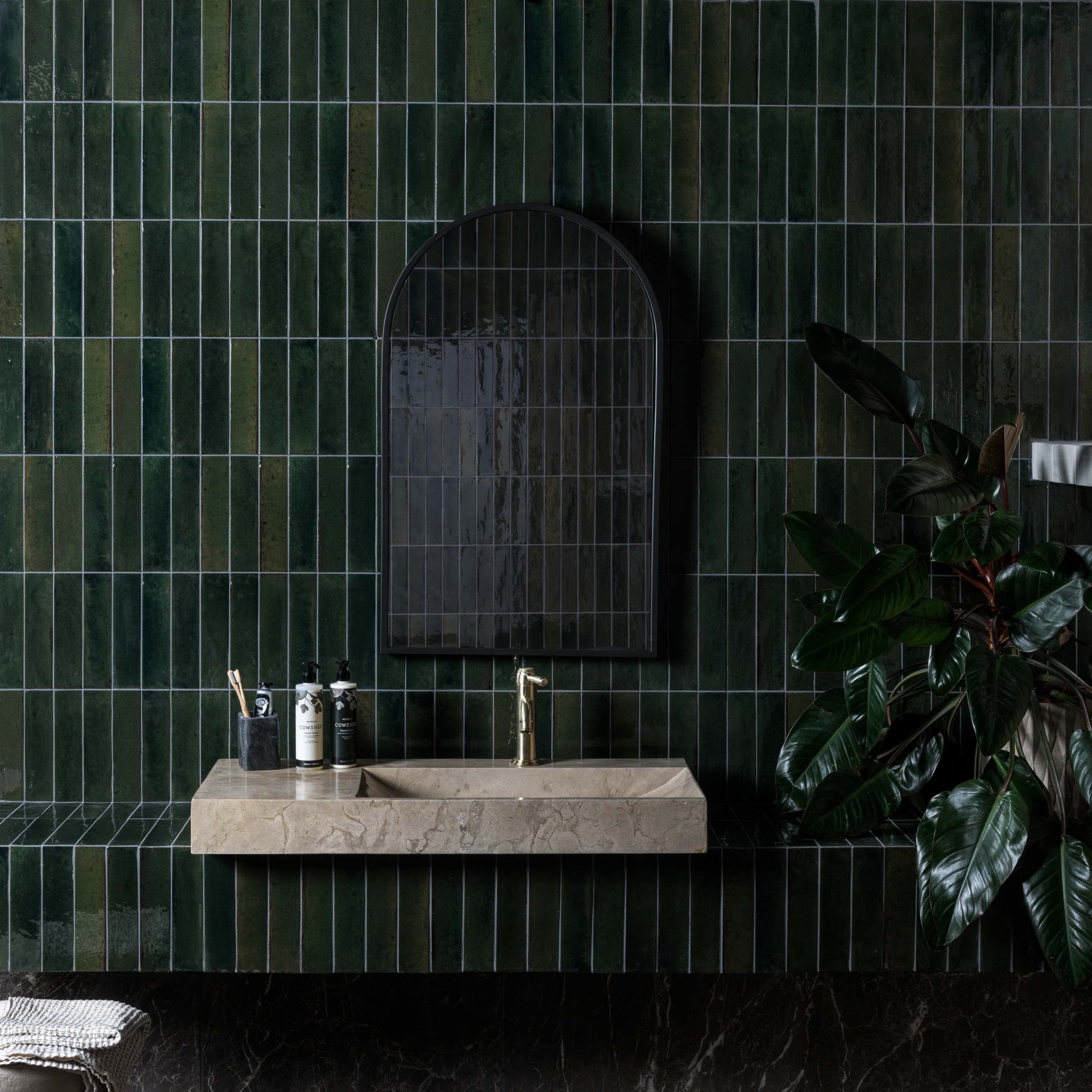 dark green glossy brick style tiles
