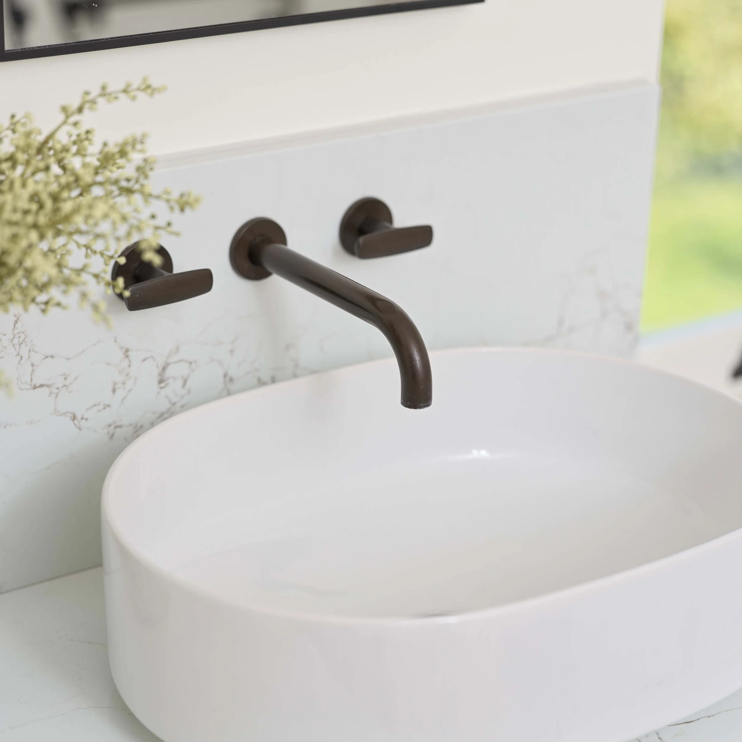 city bronze basin mixer on white basin