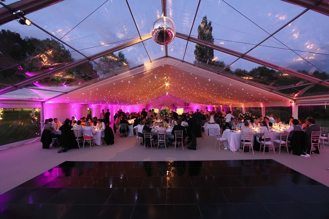 Stunning wedding marquee with clear roofs and ivory starlight lining (1).jpg