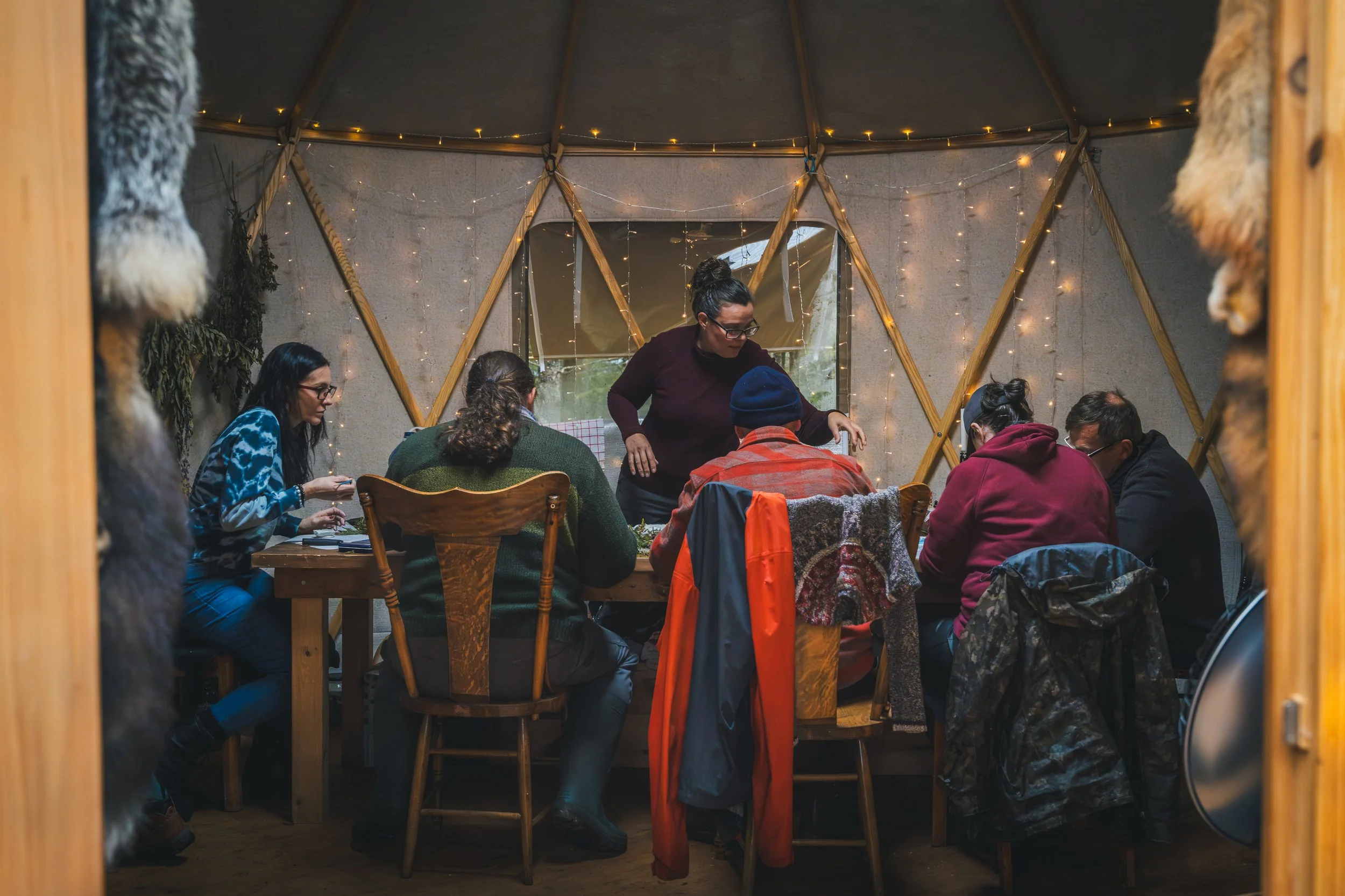 Making clay pinch pots in the yurt
