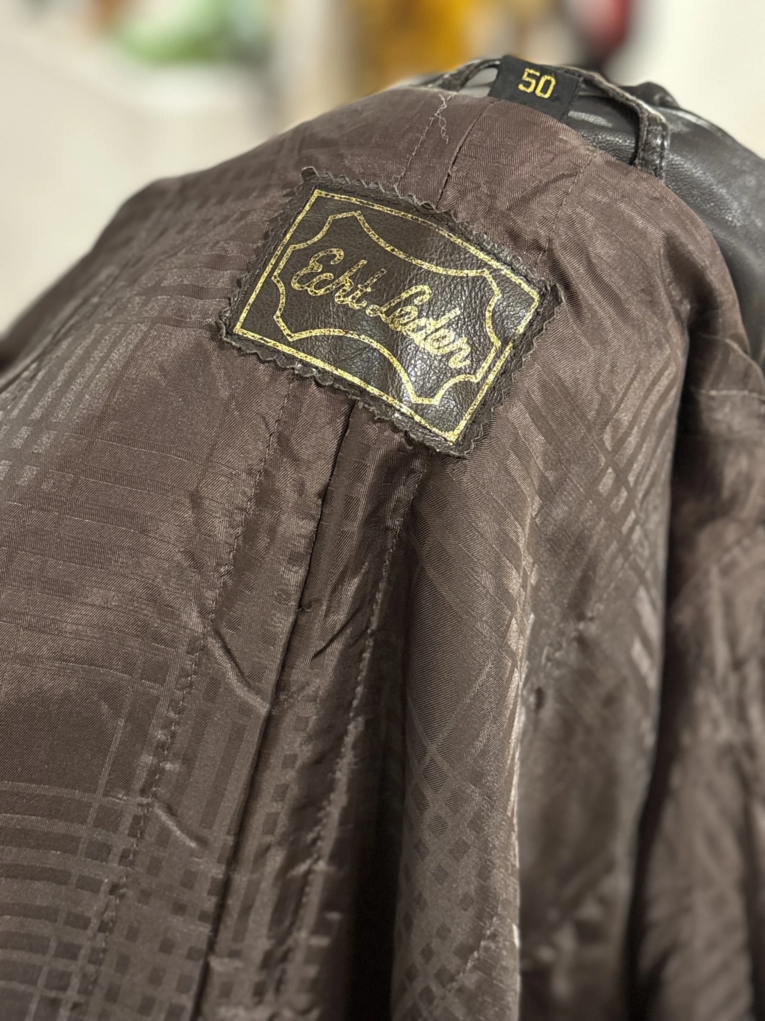 Gabardina trench vintage de piel de napa color negro años 80 made in germany