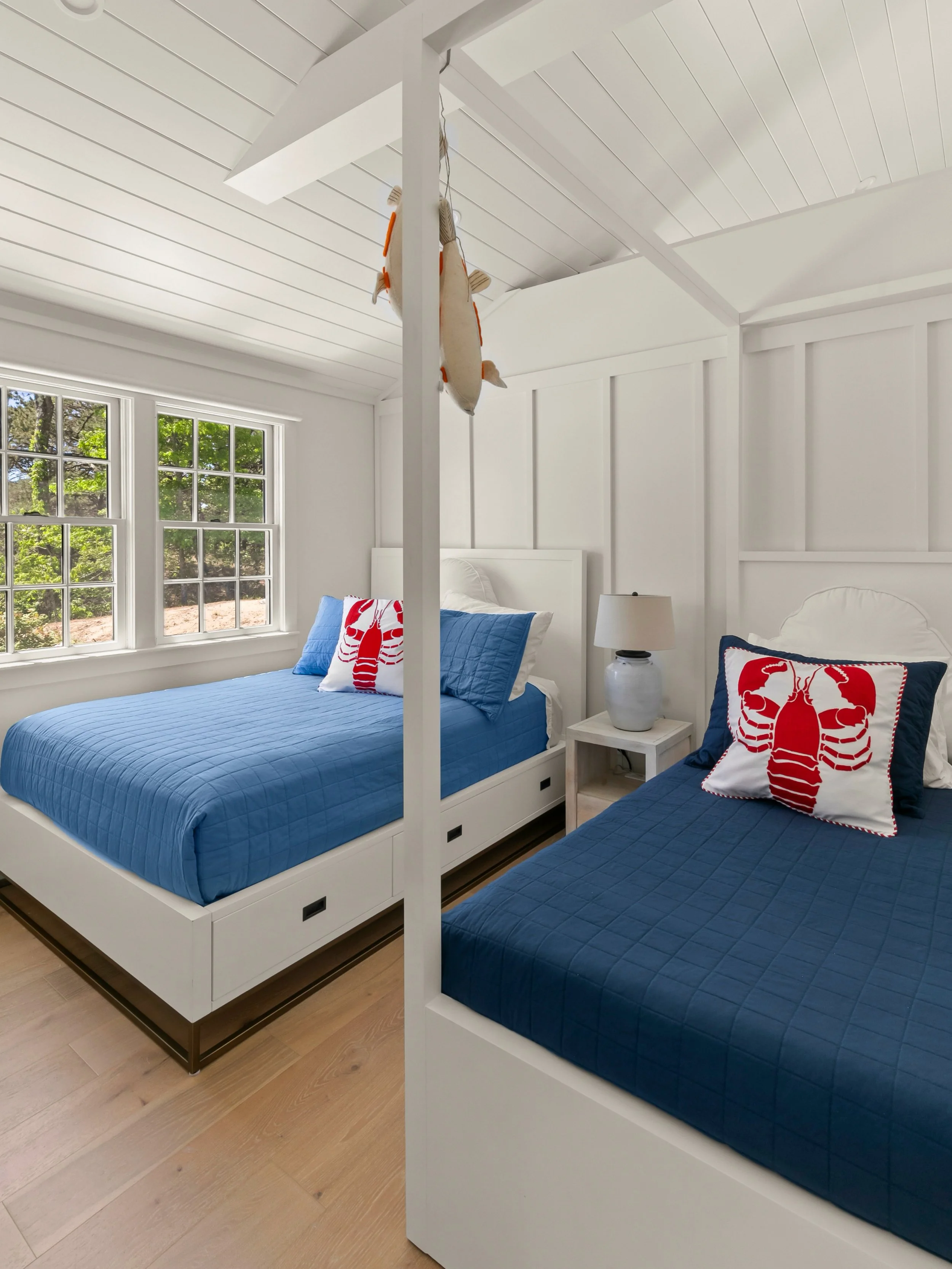 Bedroom with navy and white bedding and seaside decor - perfect for kids
