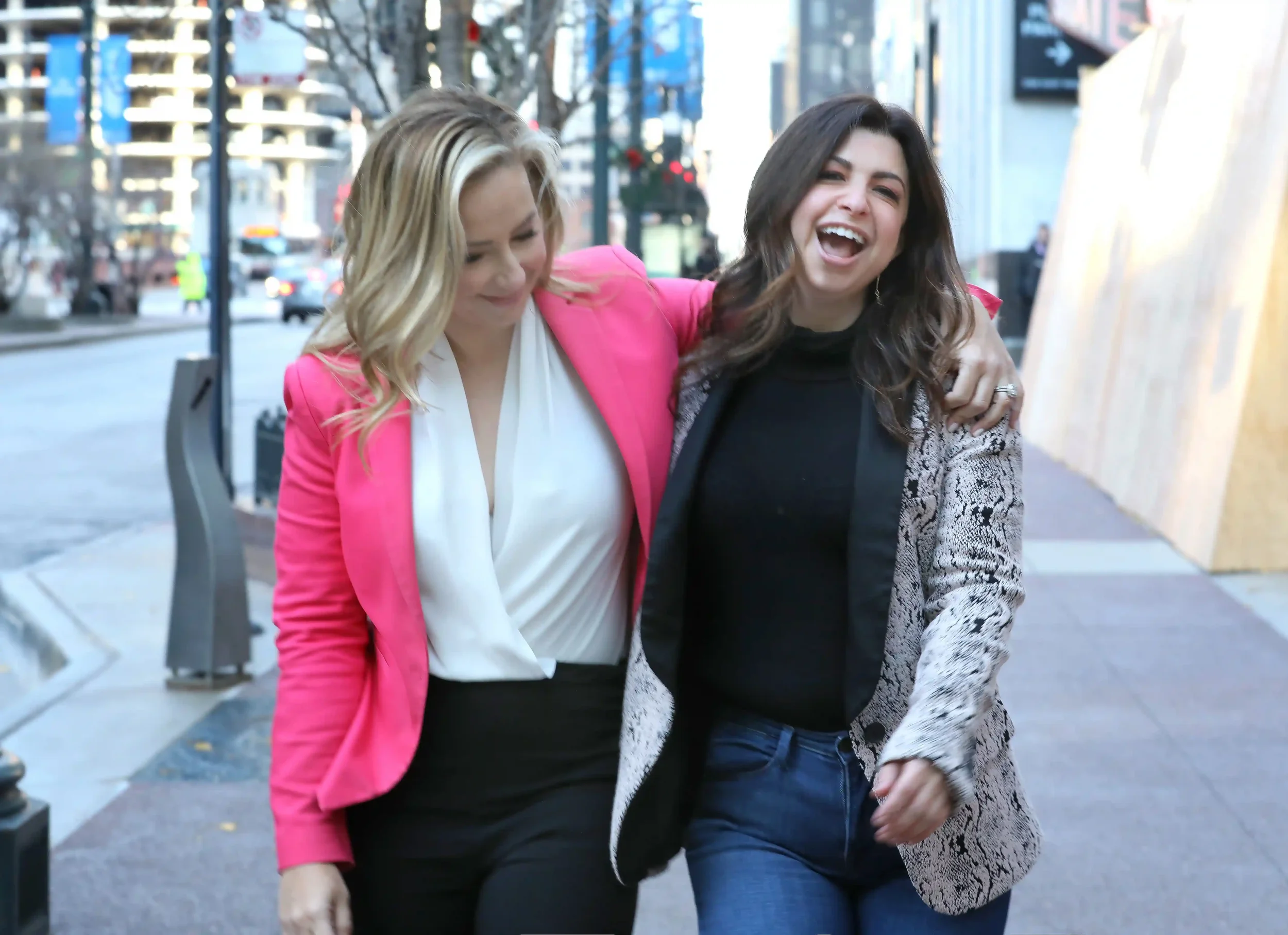 Attorney, Morgan Stogsdill and comedian Andrea Rappaport on the street in Chicago. Hosts of #1 divorce podcast, How Not Suck at Divorce
