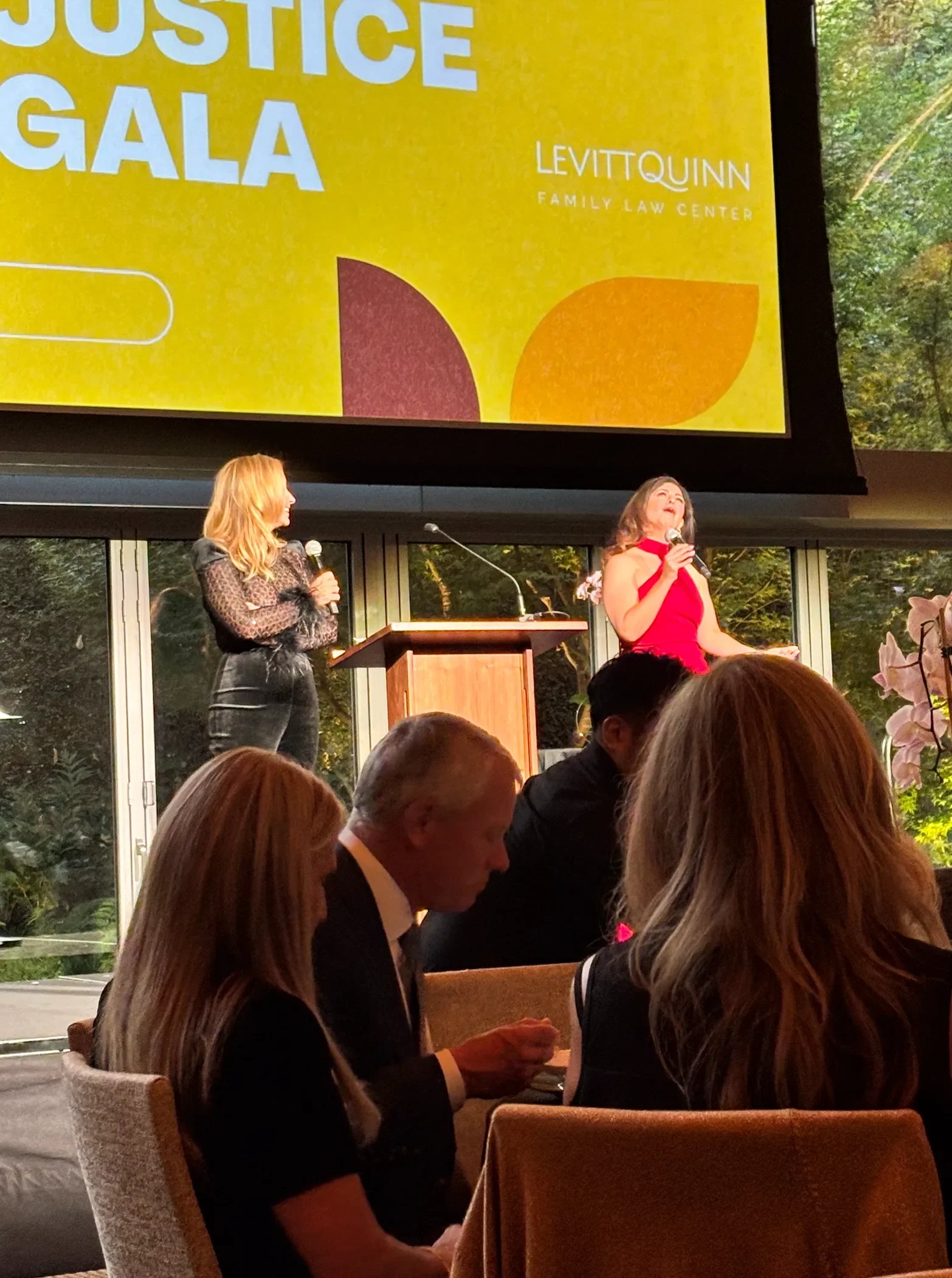 Morgan Stogsdill and Andrea Rappaport, hosts of the #1 Divorce Podcast, How Not to Suck at Divorce. Emcee's at the 2025 Levitt Quinn Stand Up For Justice Gala