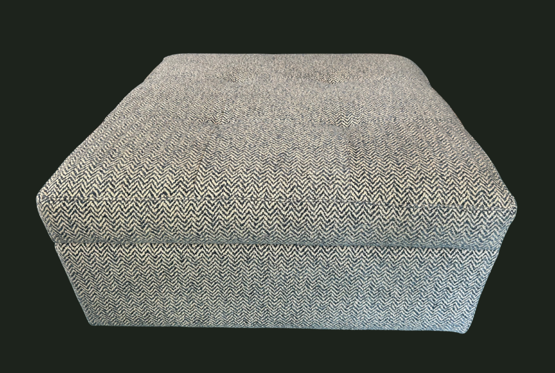 Storage ottoman with button tufting looking fabulous in Linwood herringbone wool