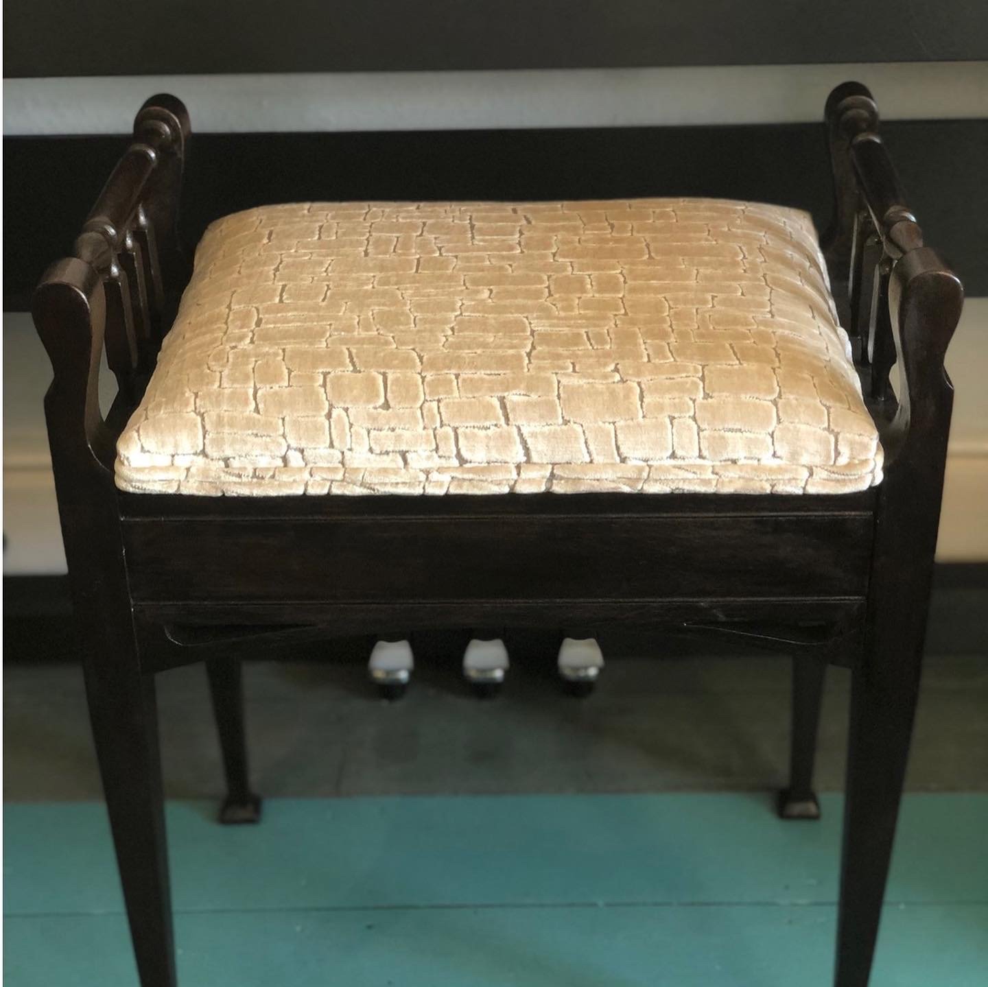 Vintage upholstered piano stool with double piping