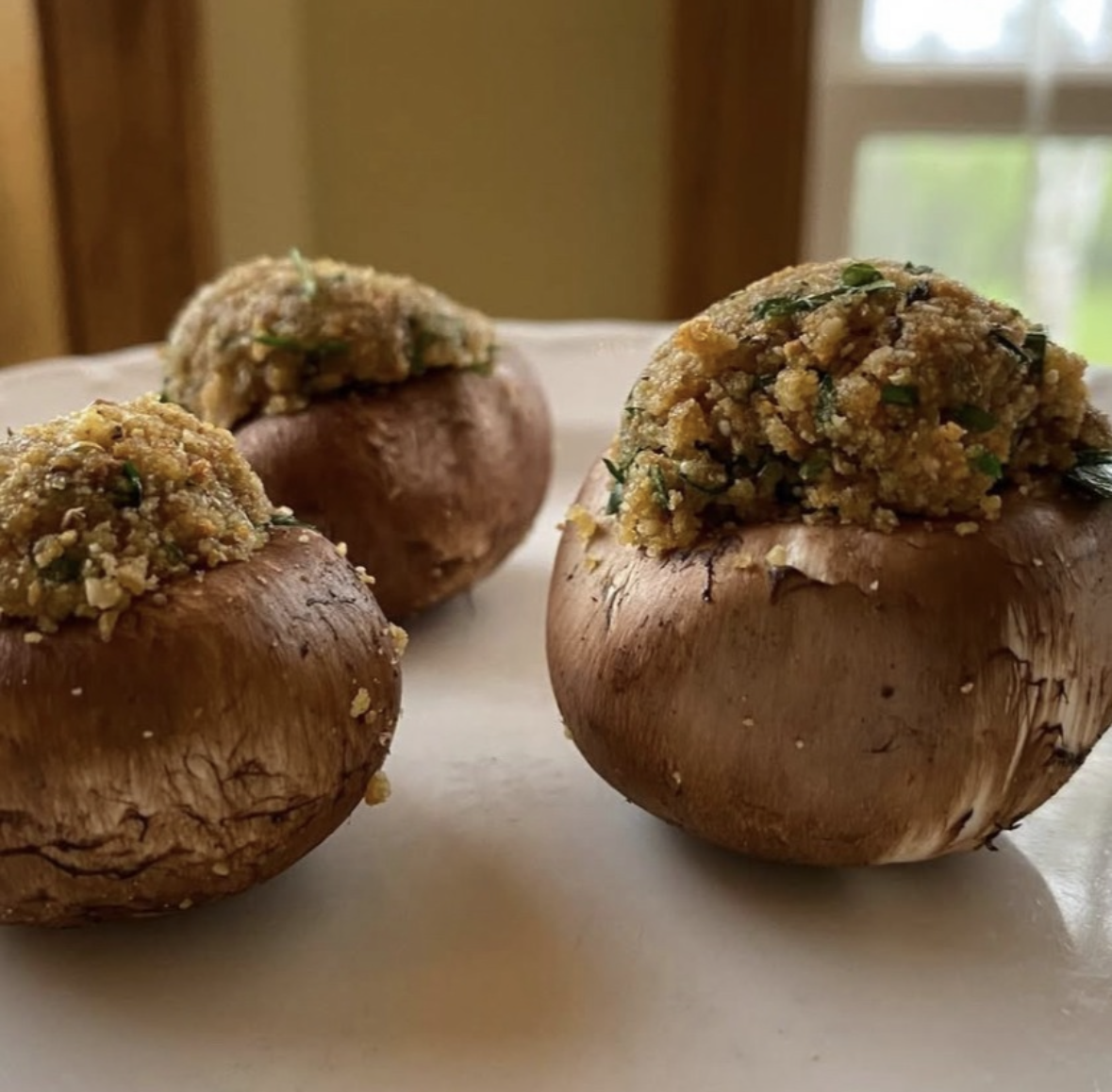 Tempeh Stuffed Baby Bellas with Herby Cashew Parmesan Crust