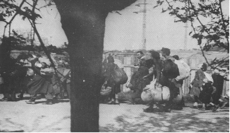 Deportation of the Jews of Munkacs, 17 May 1944. The Jews walked with their possessions from the ghetto to the brick factory, from where they were deported (Booklet of the International Conference of Munkacs Hebrew Gymnasium Students, June, 1981).
