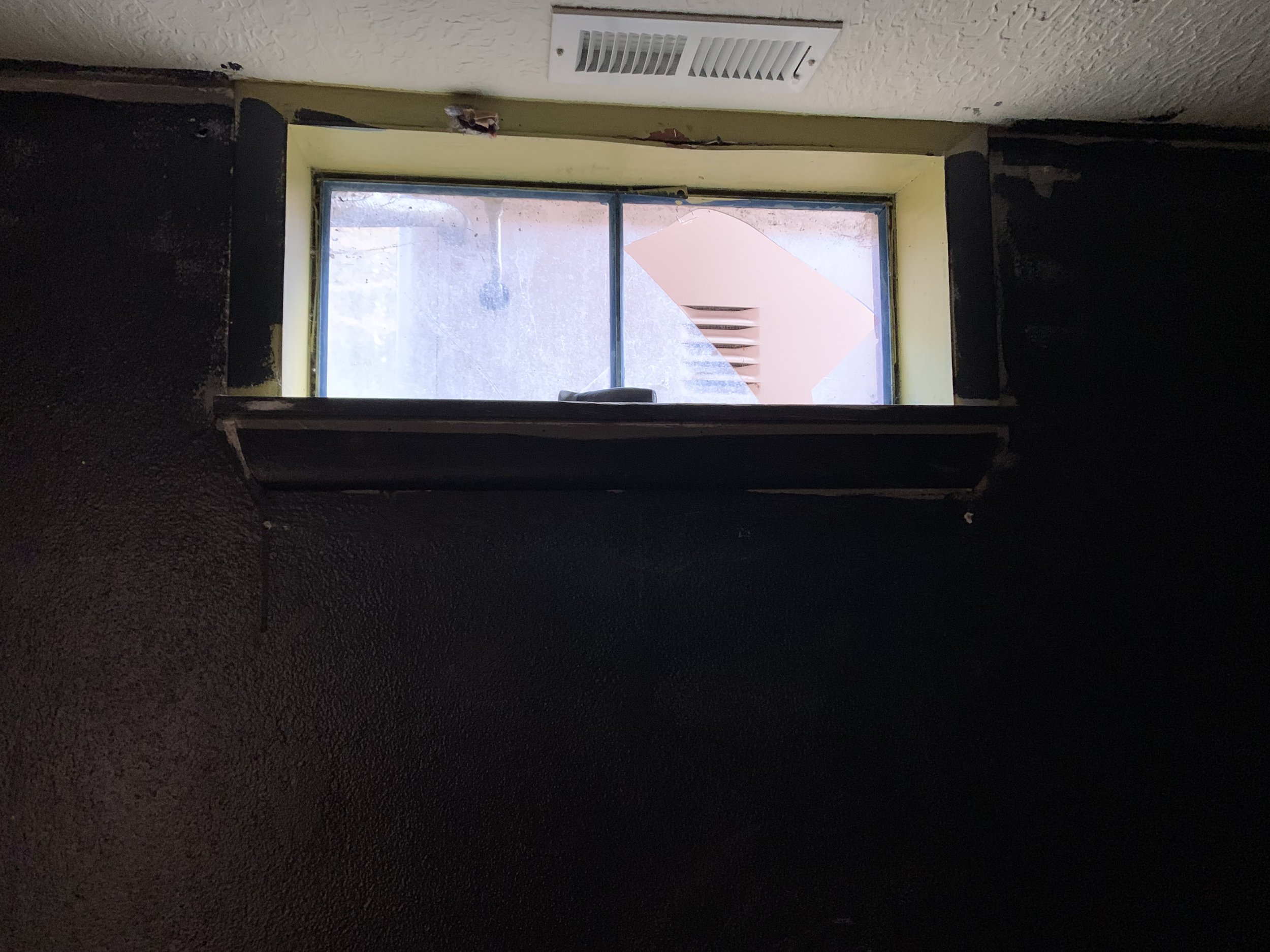 Basement Window Before.jpg