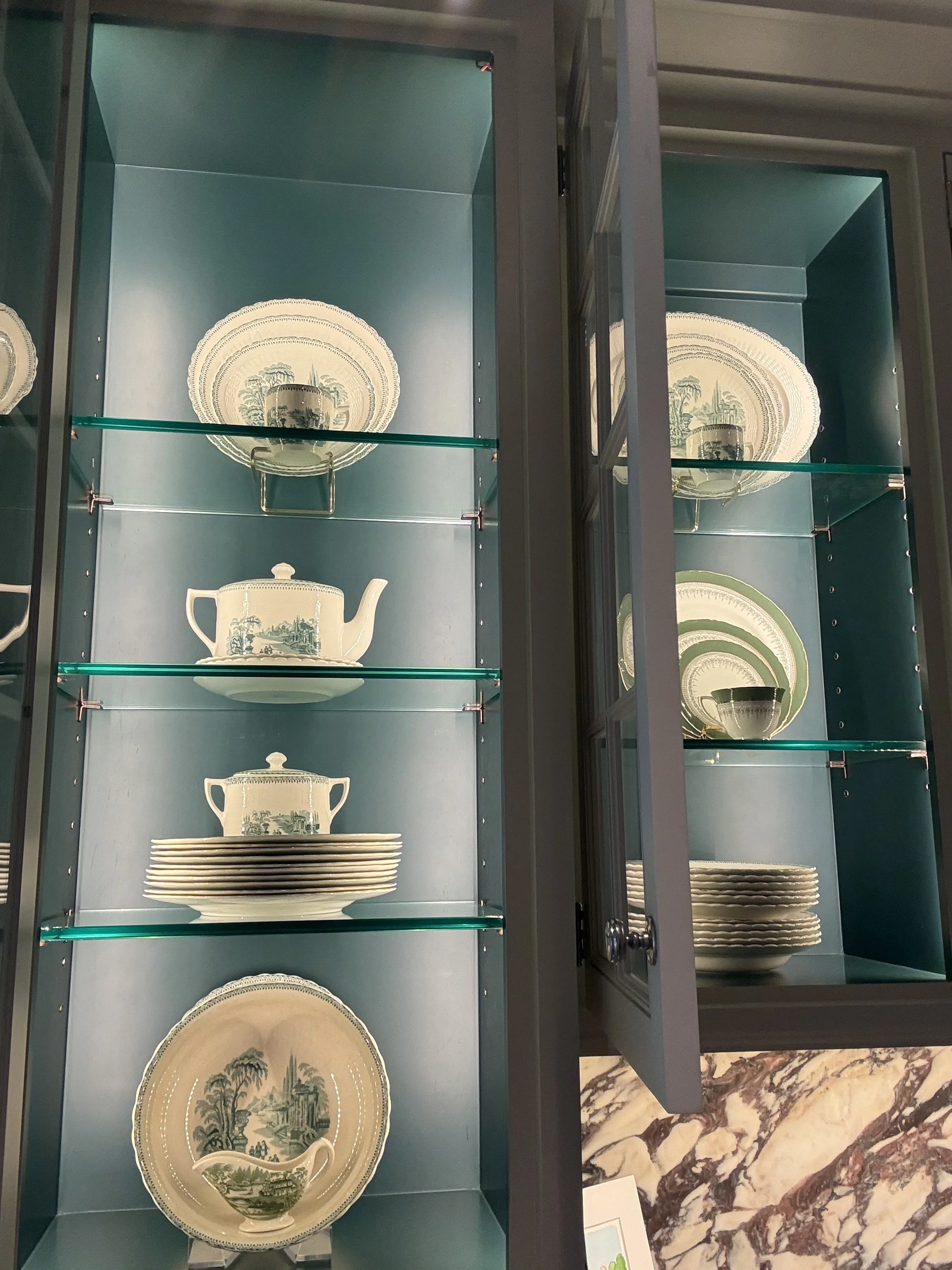 River Oaks, Houston China cabinet styled and organized like a boutique display by Luxury Pro Organizer