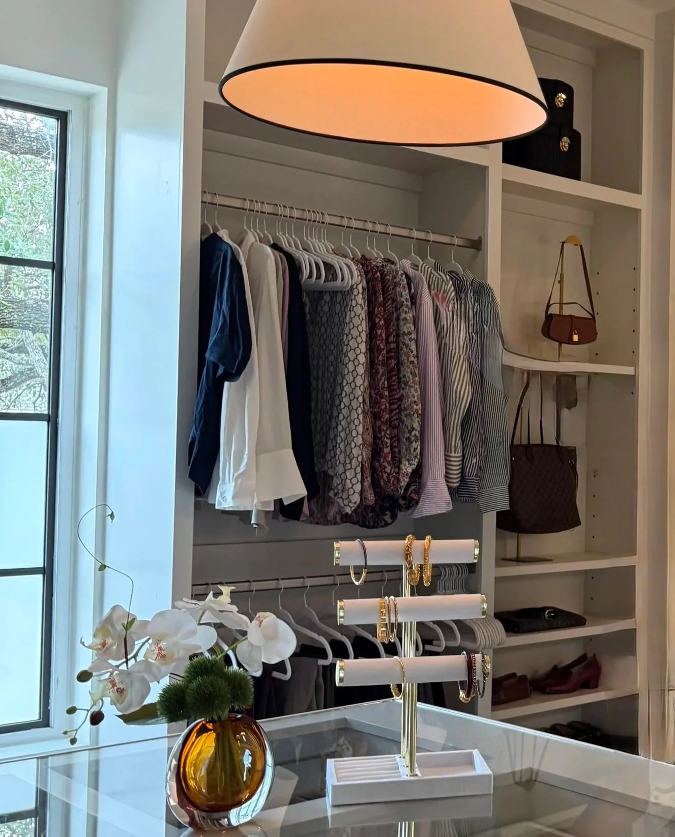 Boutique-style walk-in closet organized by Luxury Pro Organizer featuring wardrobe organization and luxury storage in Tanglewood, Houston, Texas