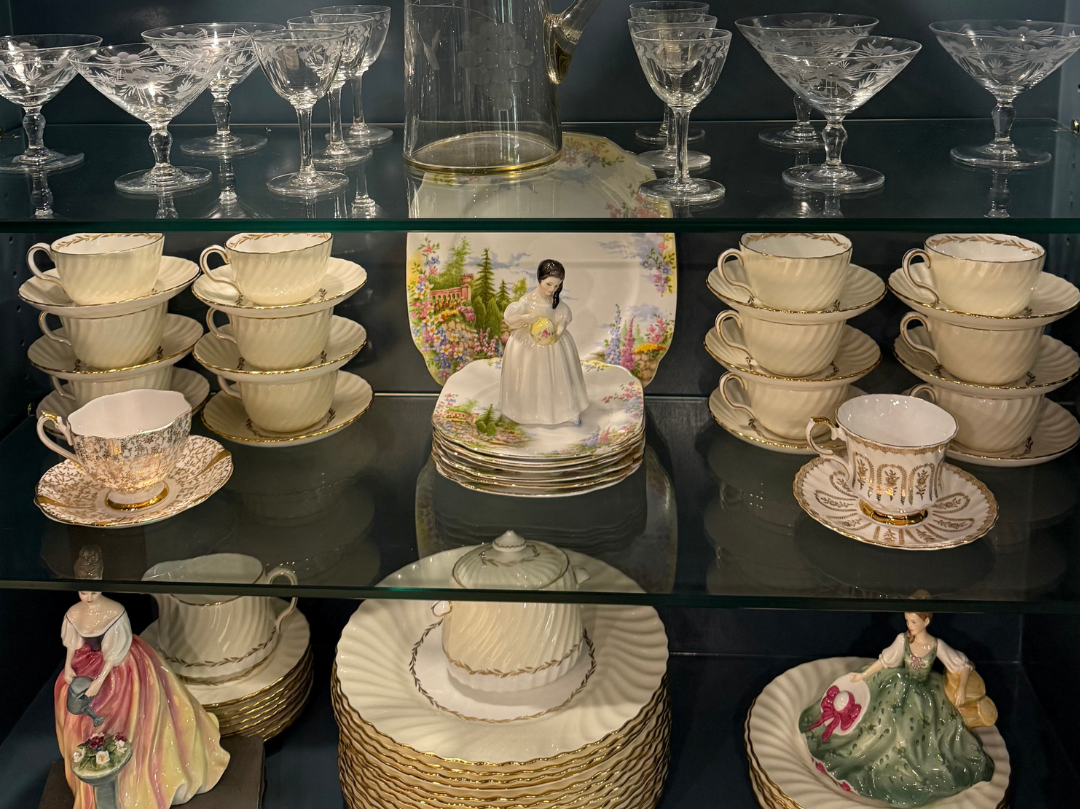 Collection of fine china intended to be passed down, illustrating the emotional side of decluttering and generational belongings.