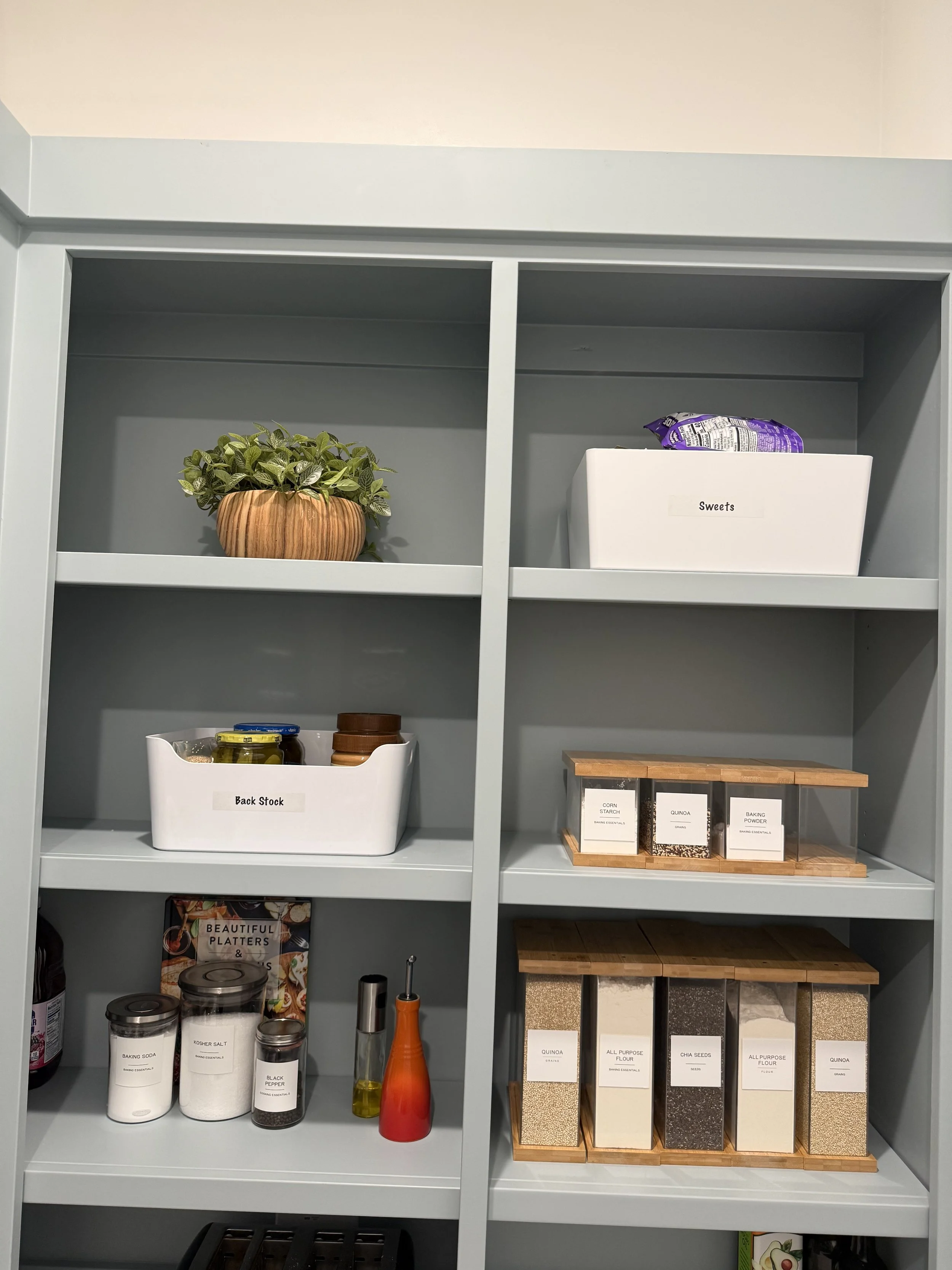 Wooden and plastic organizing products in a luxury pantry in the woodlands organized by Luxury Pro Organizer