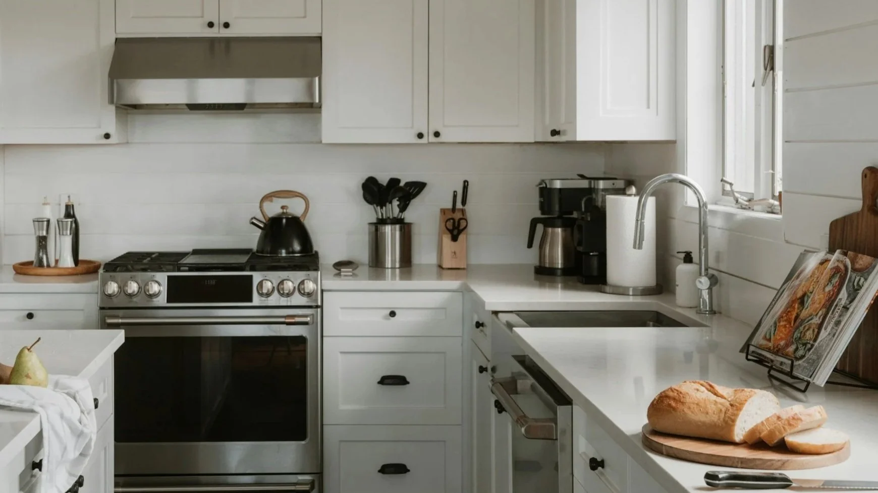 White kitchen with several counter top appliances