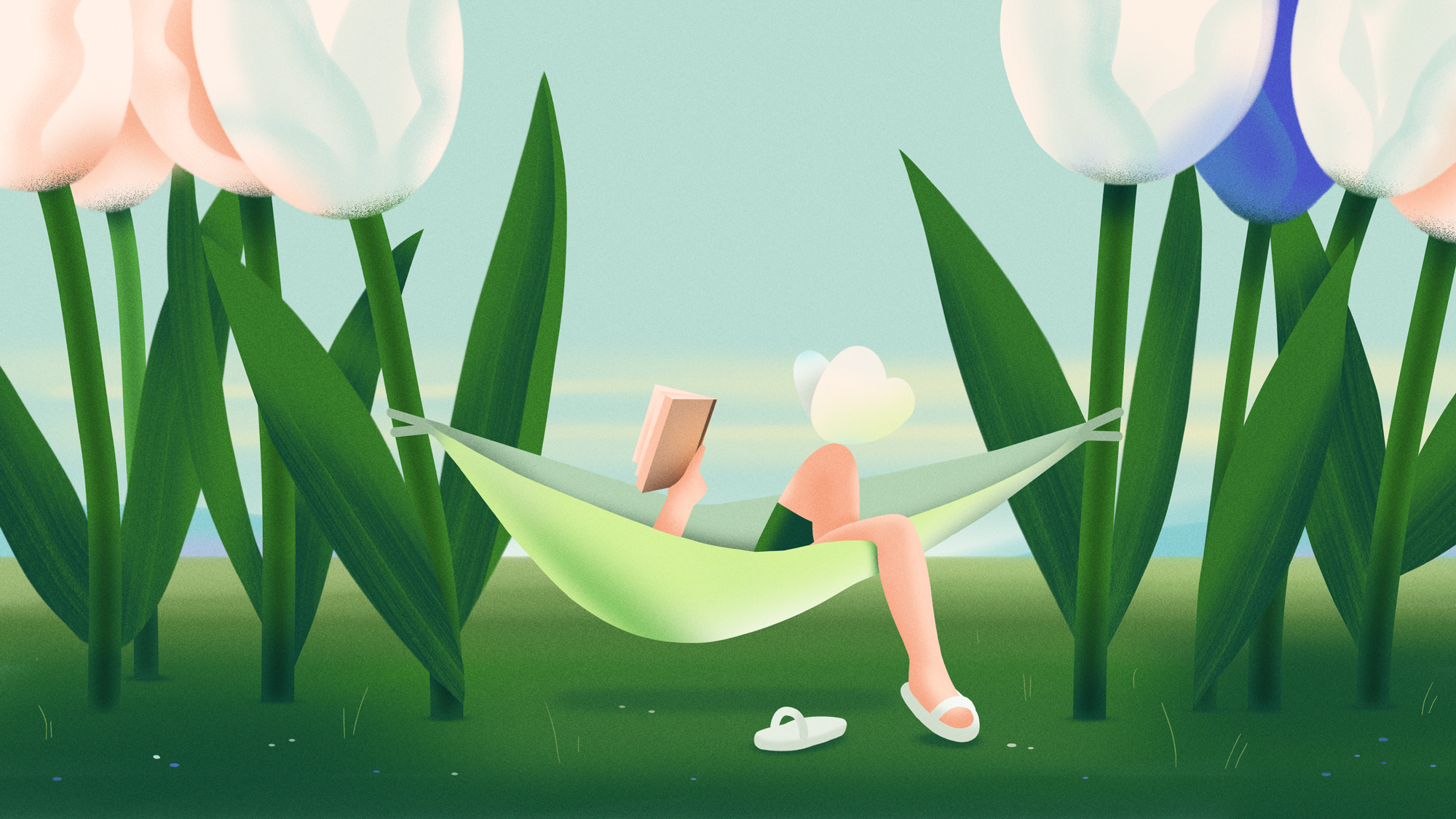A person relaxing in a hammock among large tulip flowers, holding a phone, with one shoe off on the grass.