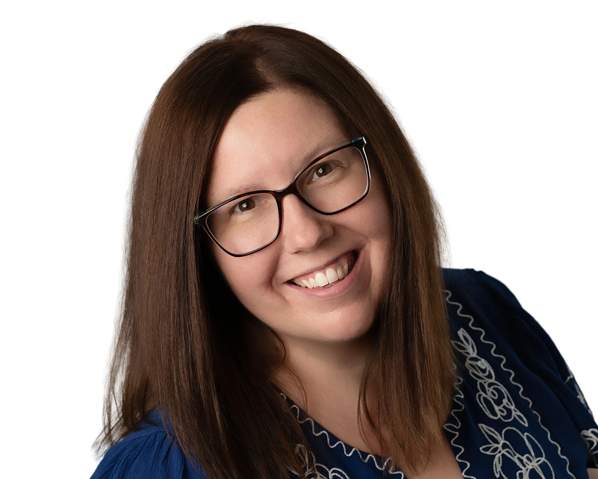 Close-up photo of a woman with red hair, pink complexion, wearing green glasses and a black top, against a white background.