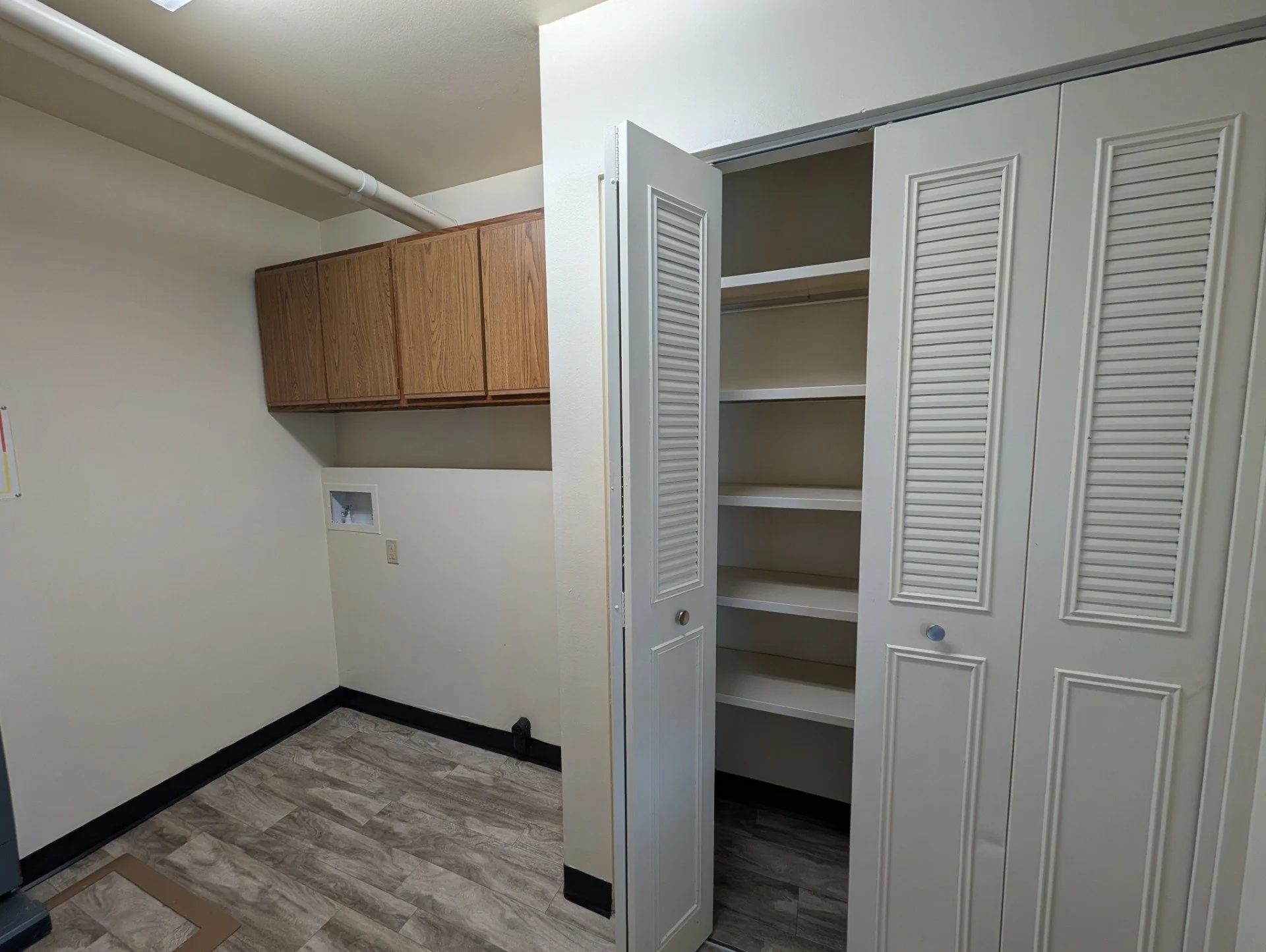 2 Bedroom laundry room with washer & electric dryer hook-ups