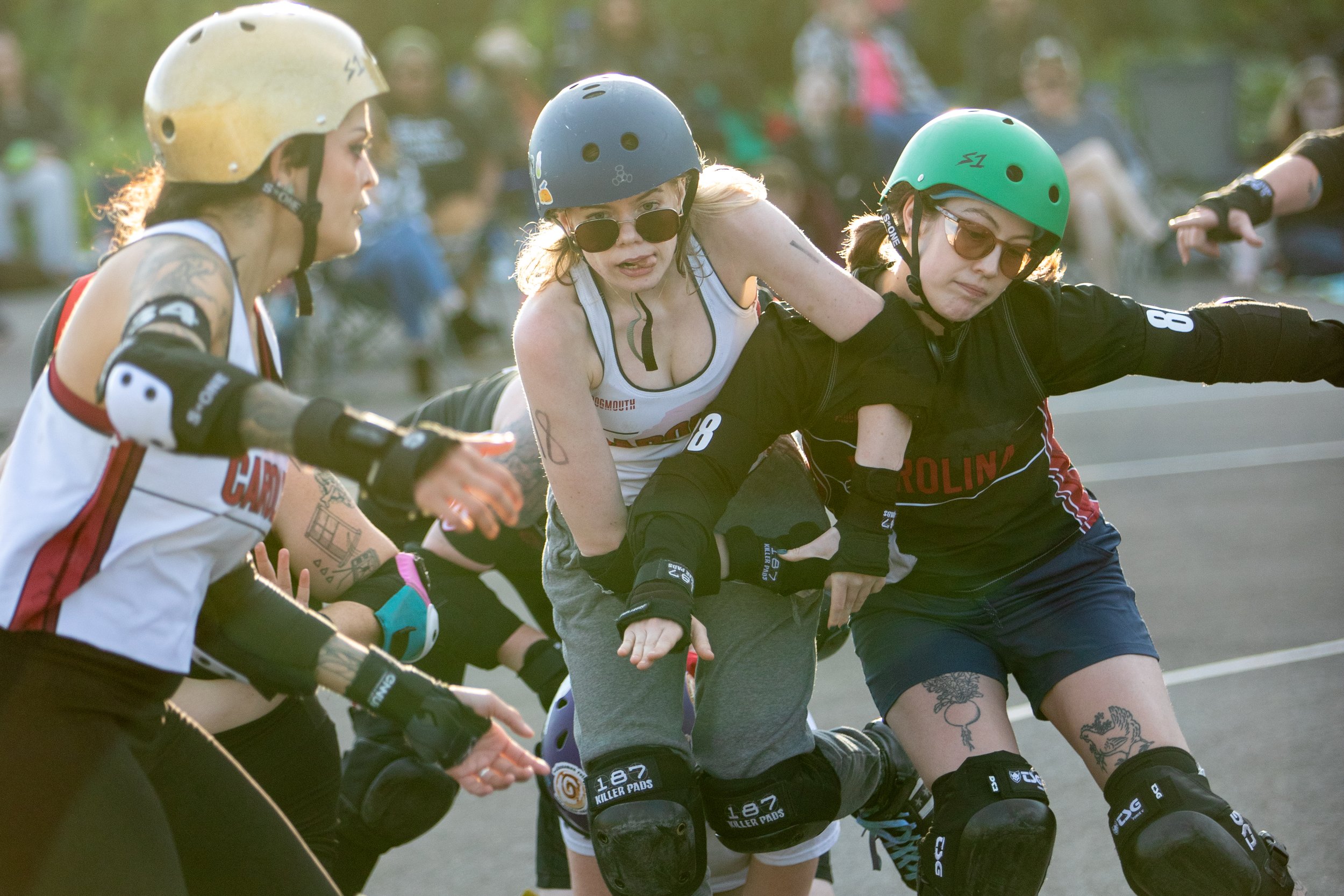 Roller derby skaters jockey for position and points.