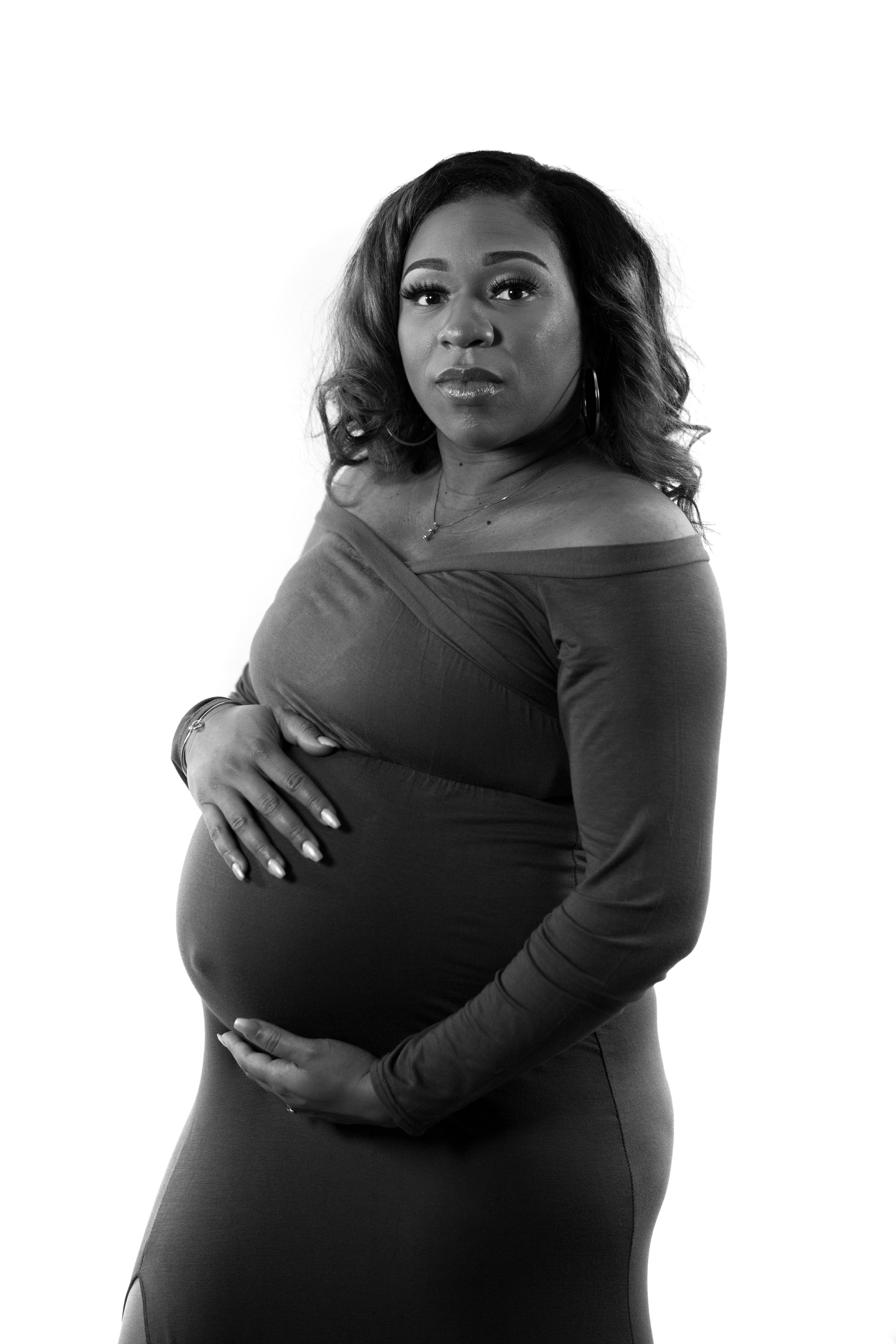 Ashley, a first-time mother, holds her son-to-be, King'Roy Ali.