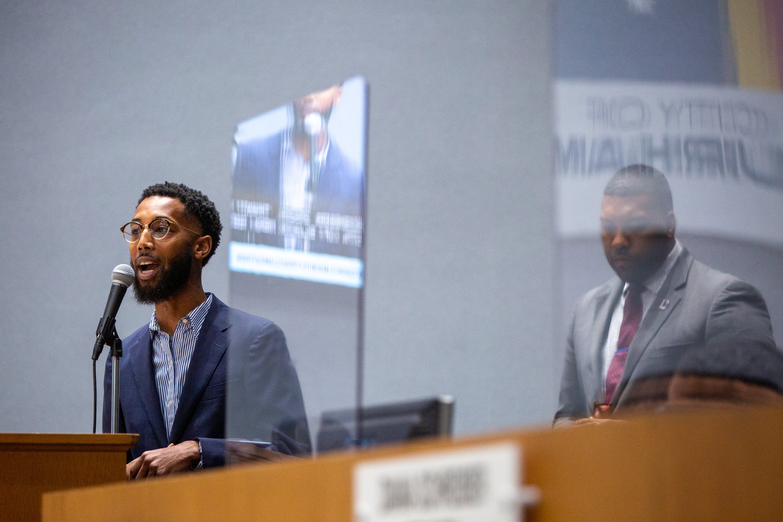 Derek Rhodes speaks before receiving an award for Youth Mentoring Month at a city council meeting in Durham, North Carolina.
