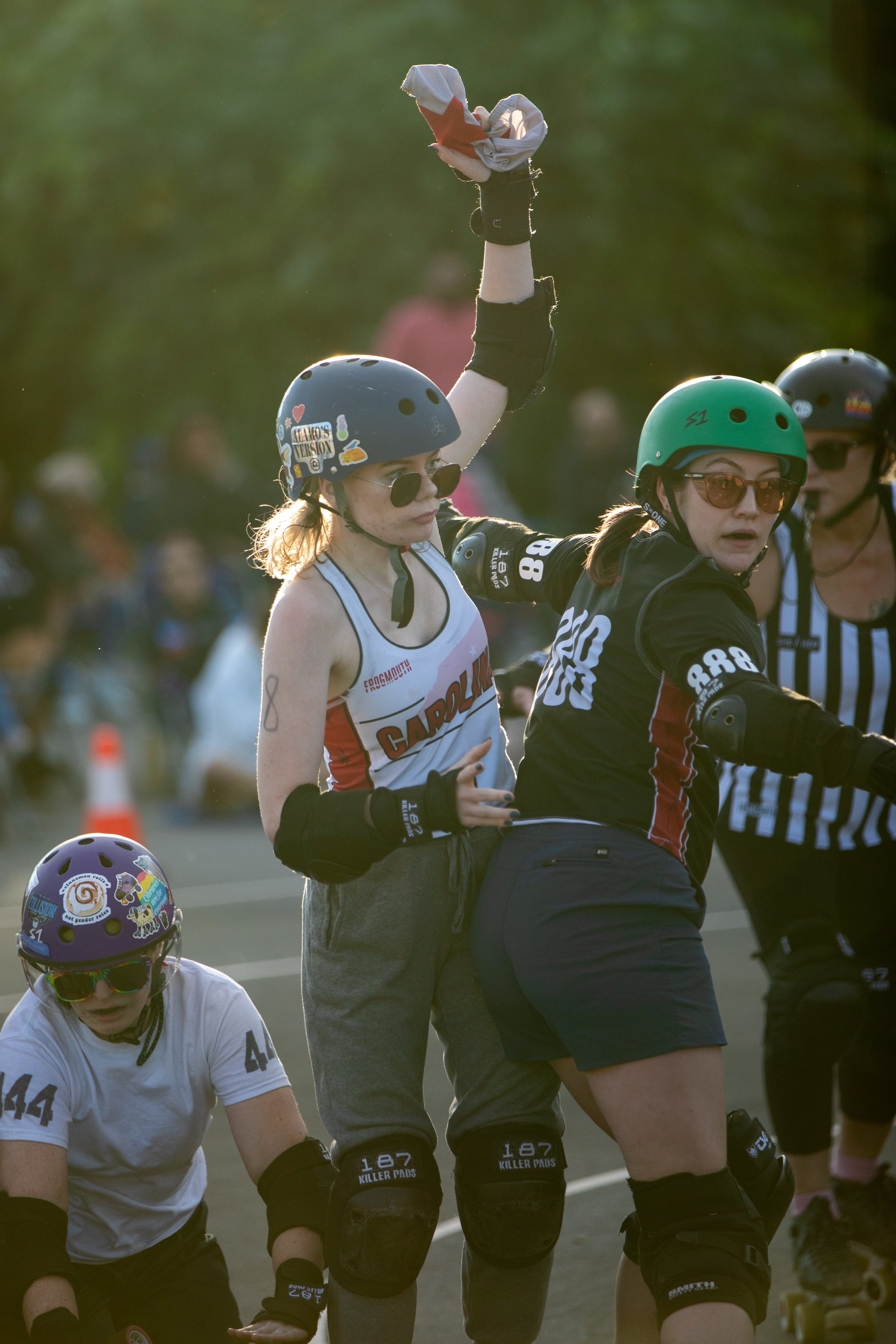 A roller derby skater attempts a star pass — a maneuver to exchange offensive positioning — in Raleigh, North Carolina.
