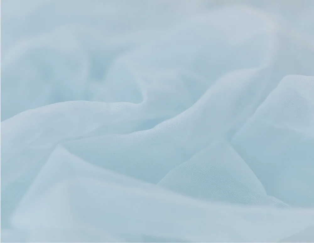 Light blue, soft fabric with gentle folds and creases.