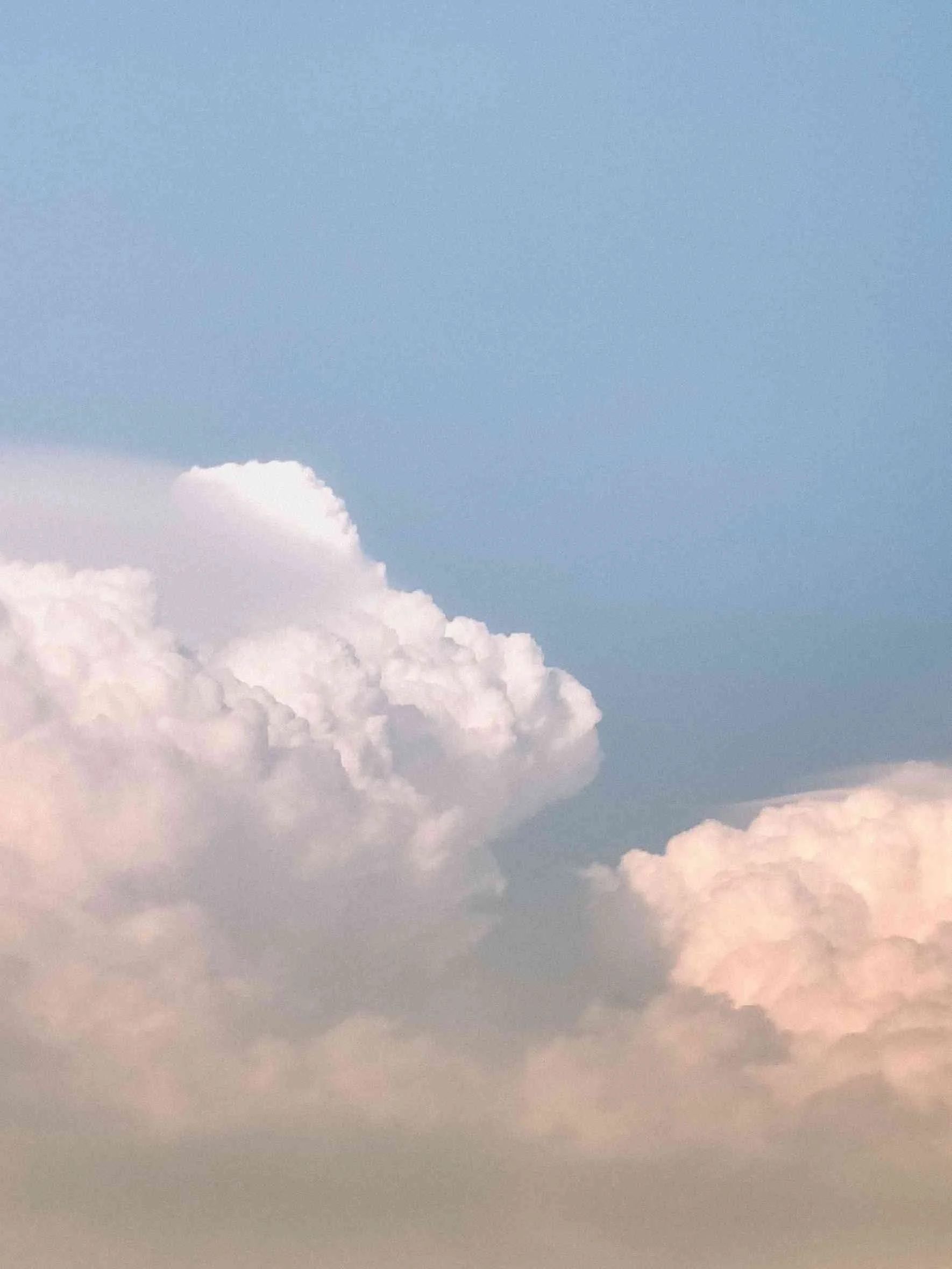 Blue sky with white fluffy clouds.