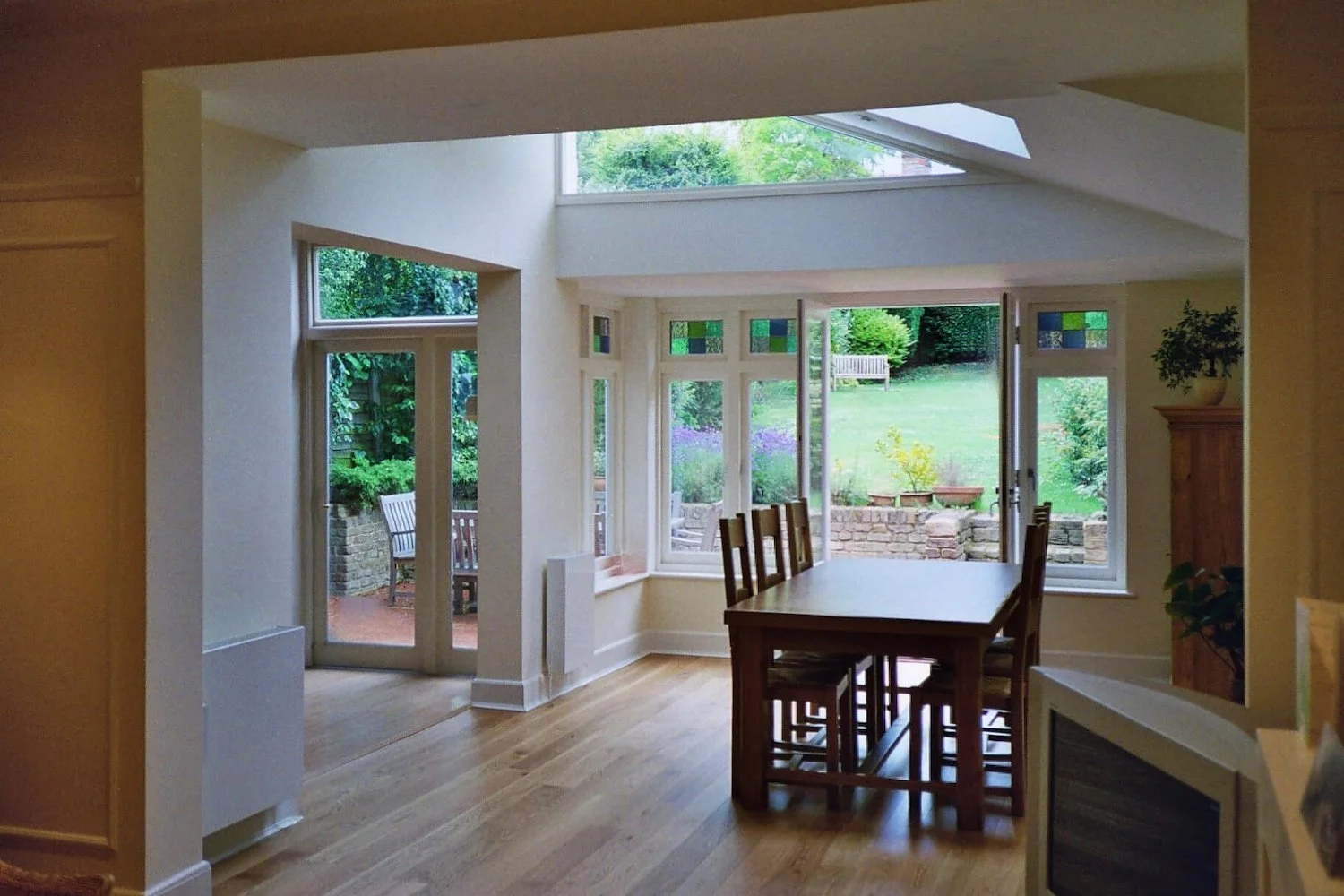 Rear side extension to a terraced house in Crouch End, North London. On a steeply sloping site, this dining room extension achieves the aim of getting the maximum amount of daylight into the inner rooms.