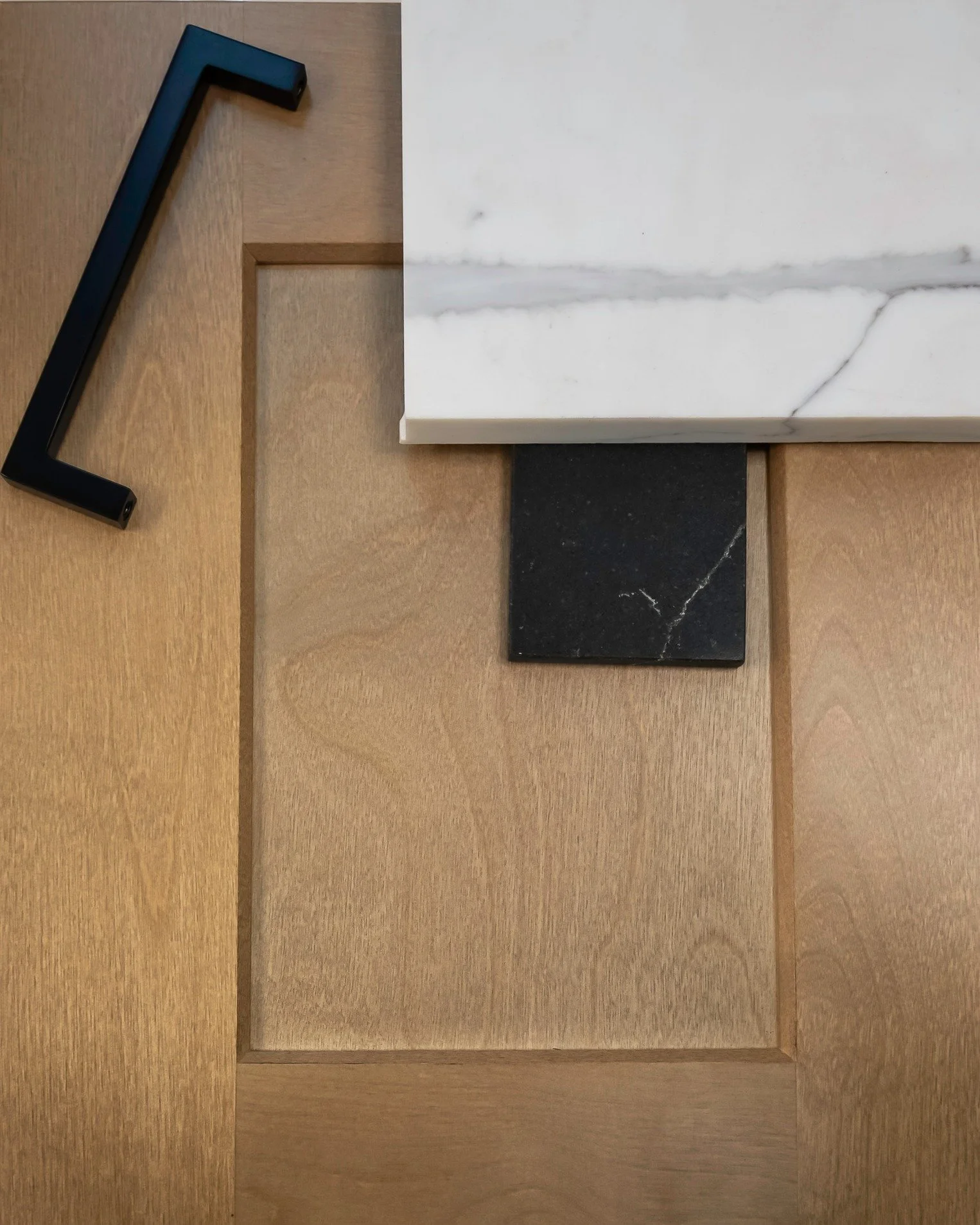 Luxury often lives in restraint, and this palette captures that perfectly. 

Instead of loud patterns or high-gloss finishes, the focus is on natural texture, soft movement, and balanced contrast. The wood grain adds richness, the stone introduces el